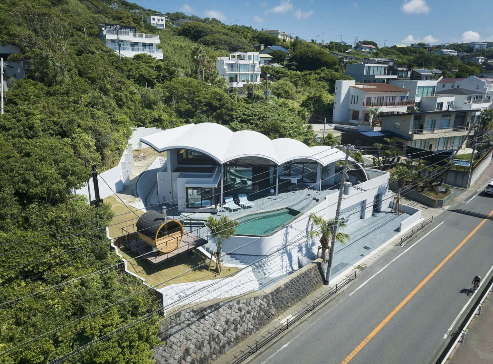 A contemporary residential house with a glass exterior.