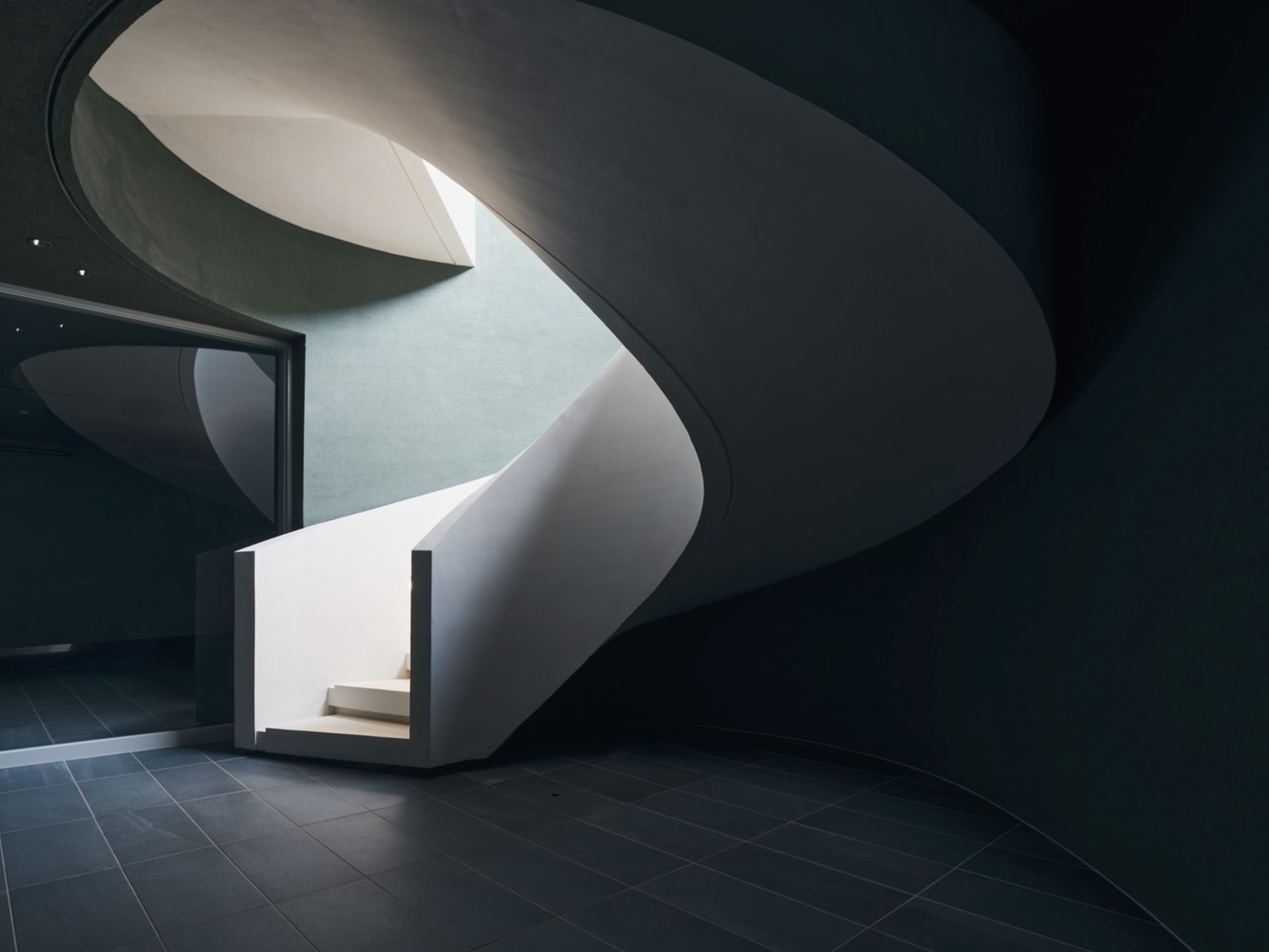 Modern staircase made of white concrete materials.