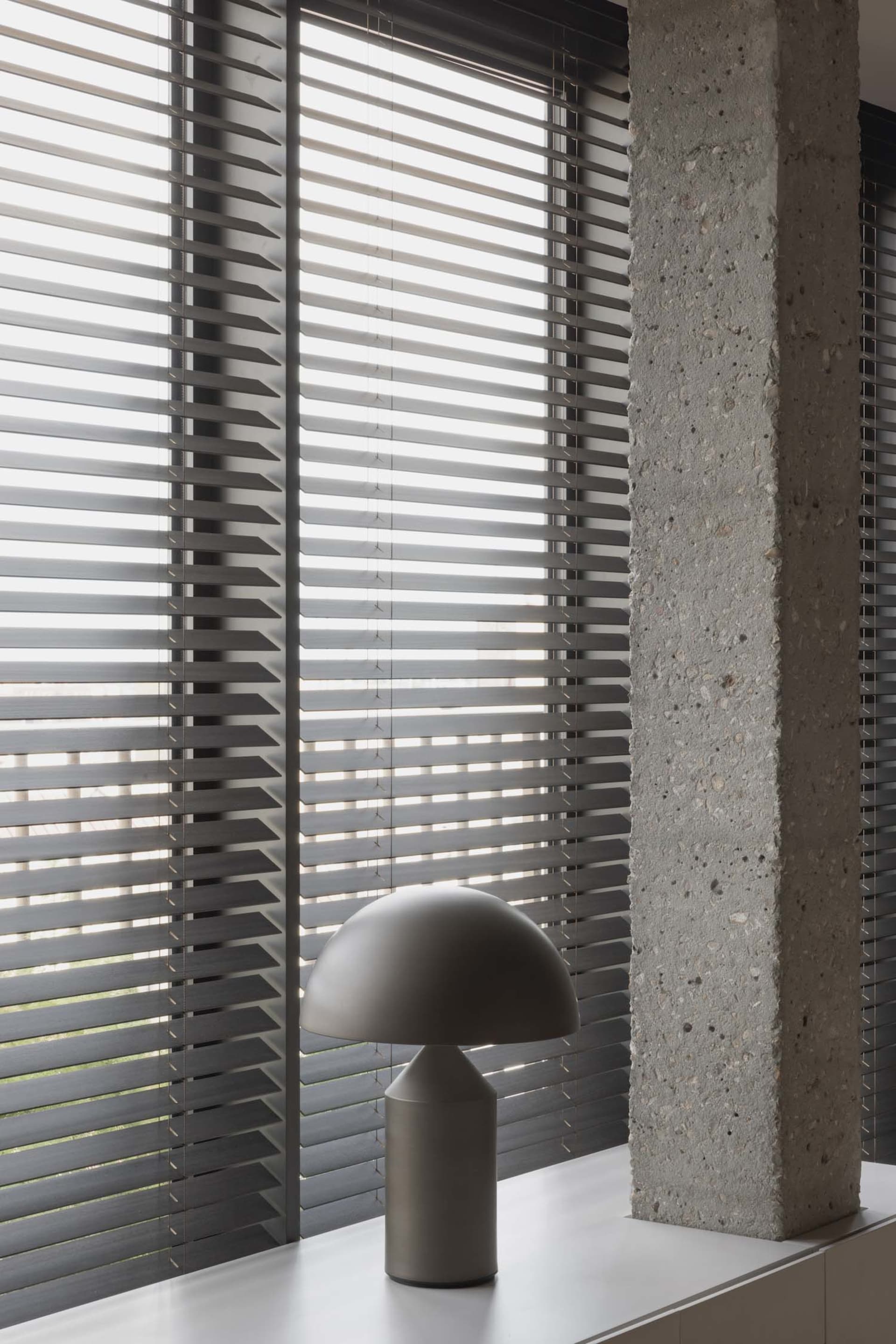 Image of a minimalist interior design featuring concrete elements.