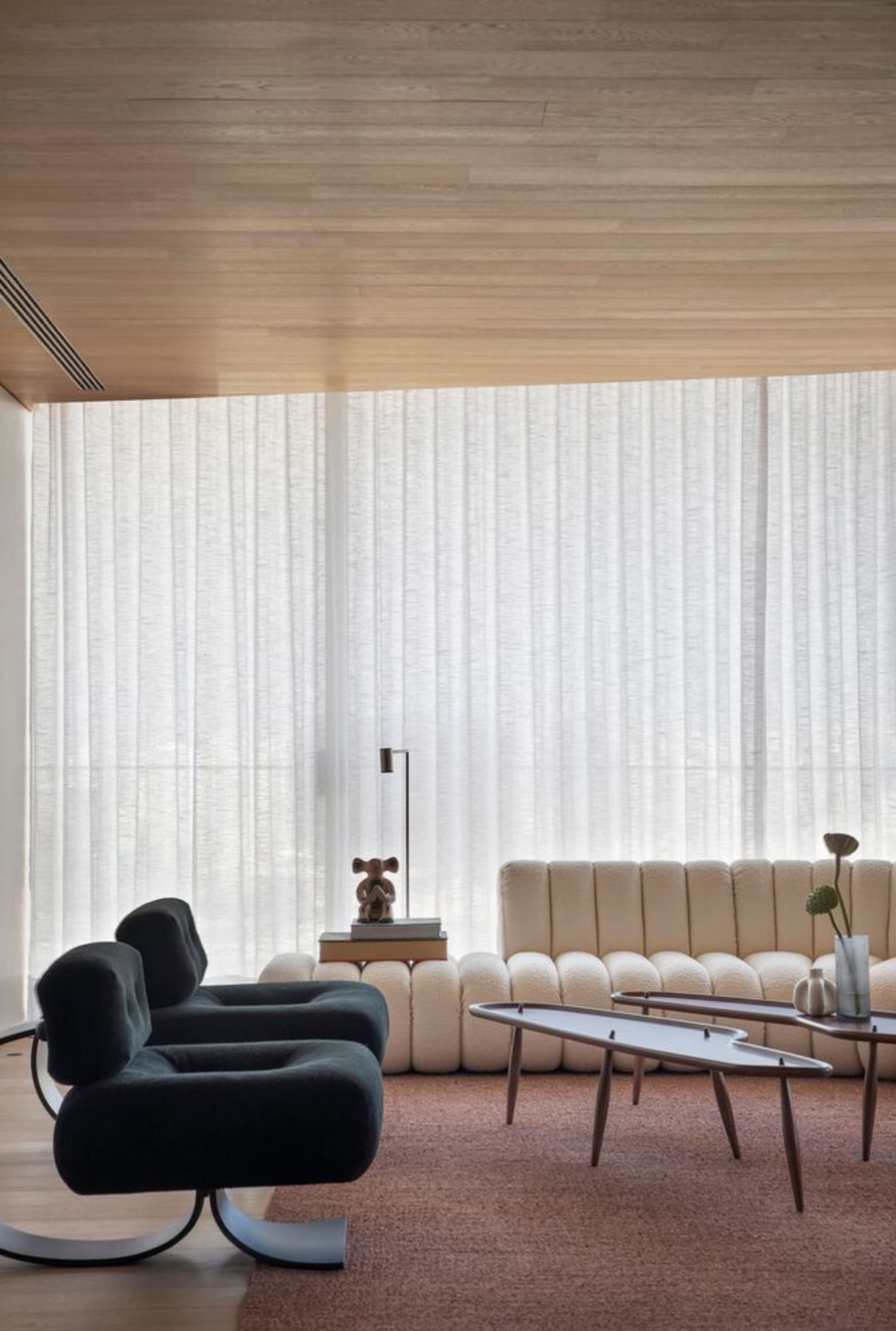 Modern interior design featuring fabric curtains in a living room.