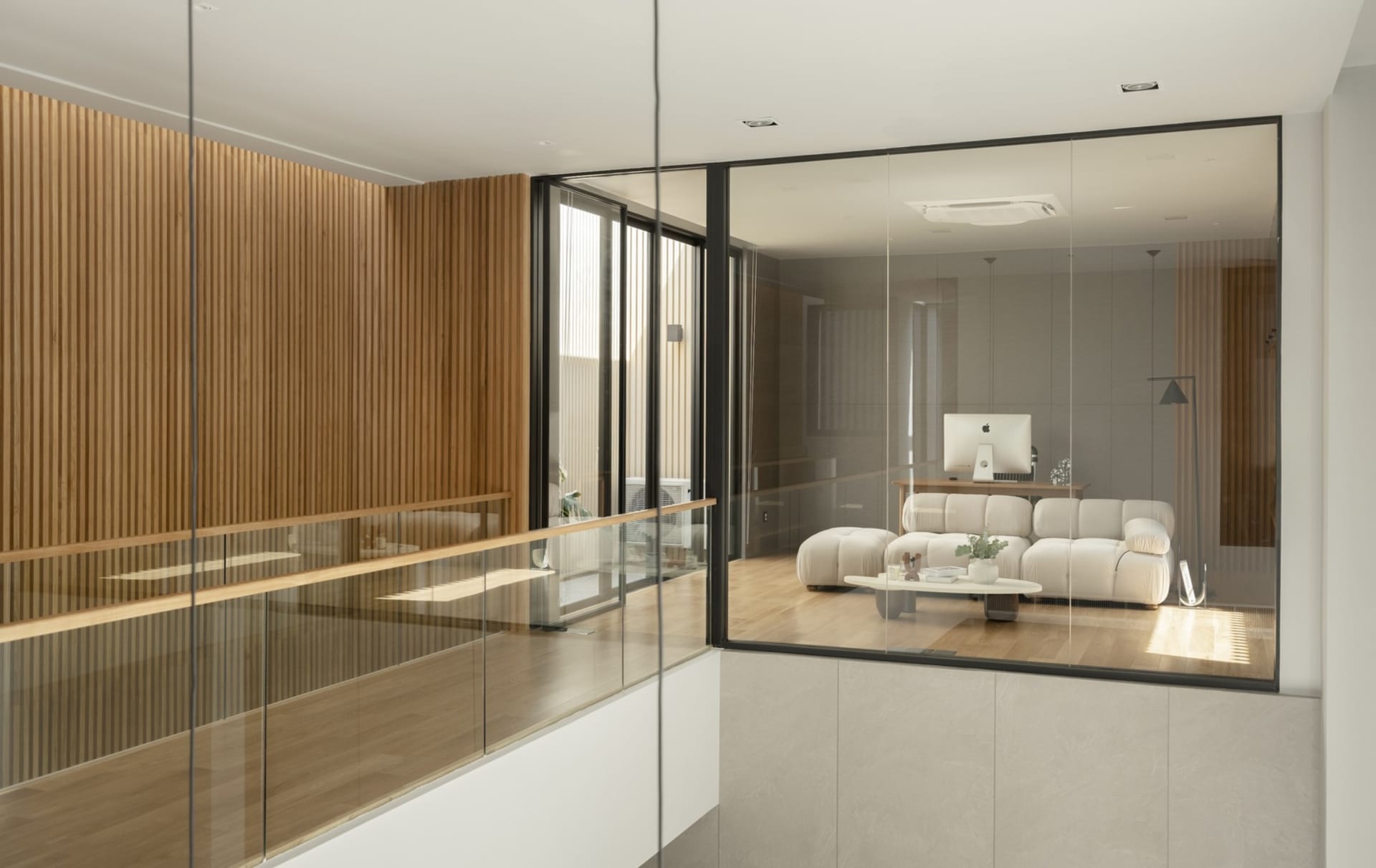 Modern living room featuring wood and glass materials