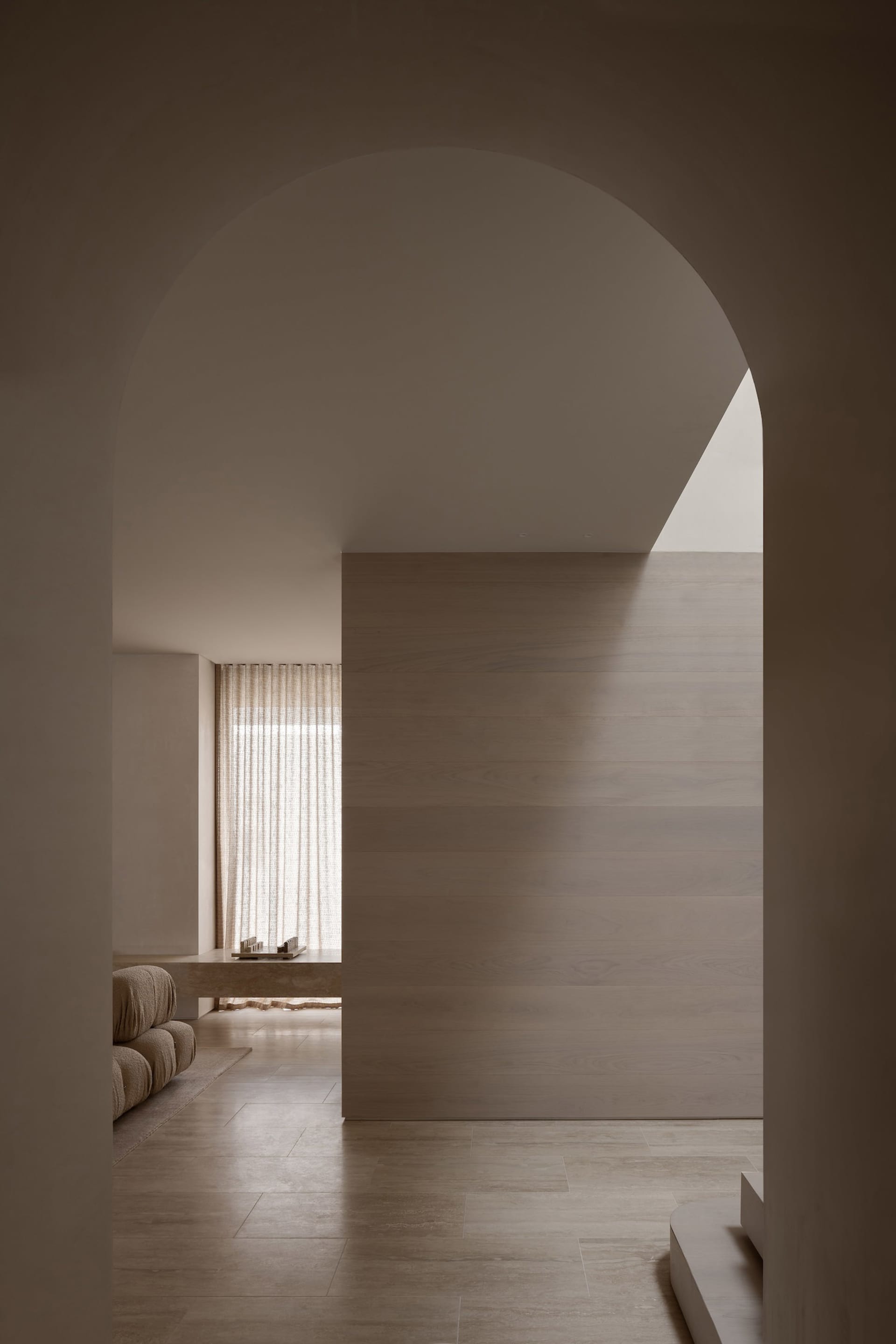 A minimalist residential interior with wood elements.