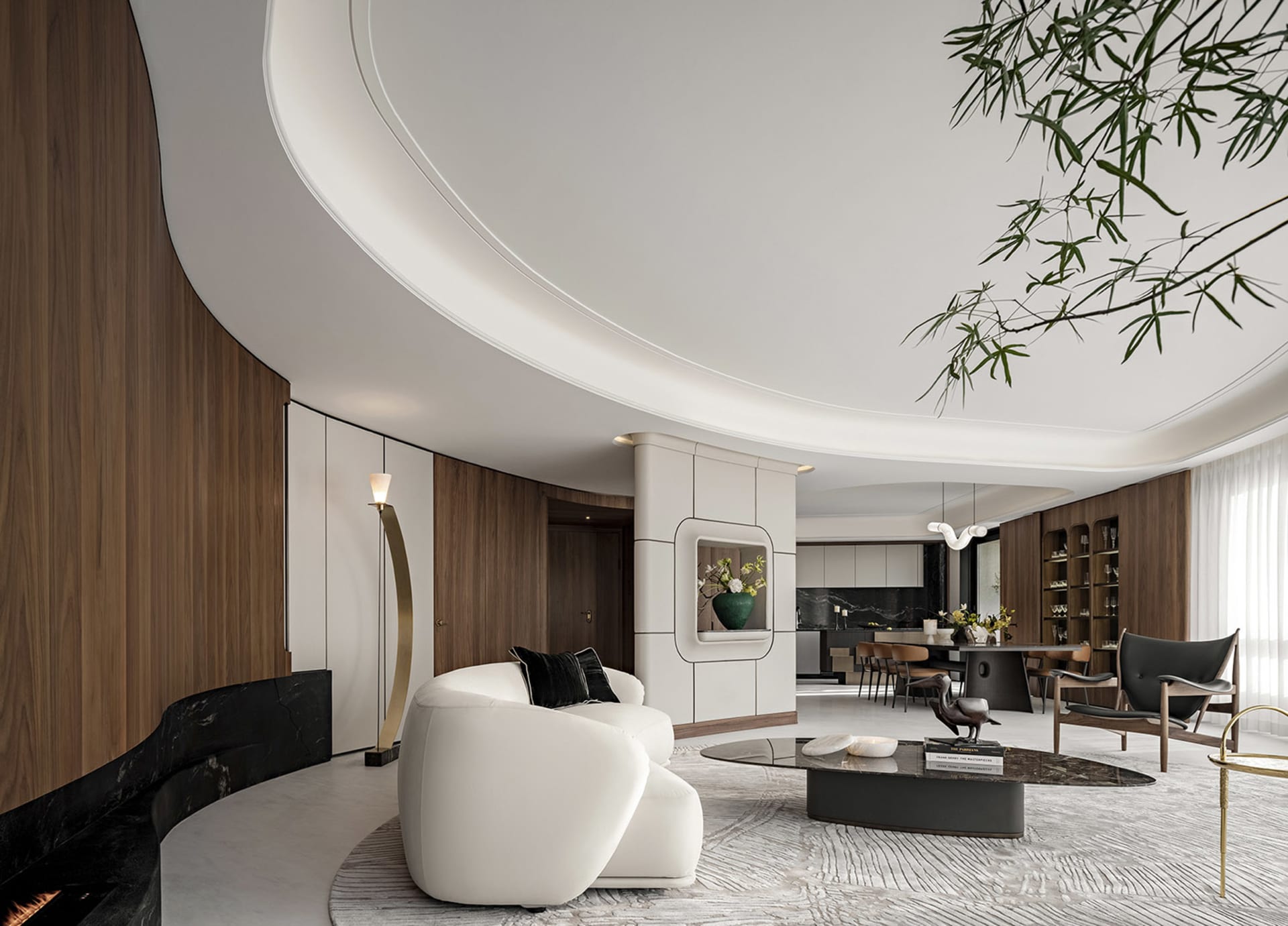 Modern living room with white leather sofa, wooden walls, and black marble fireplace.