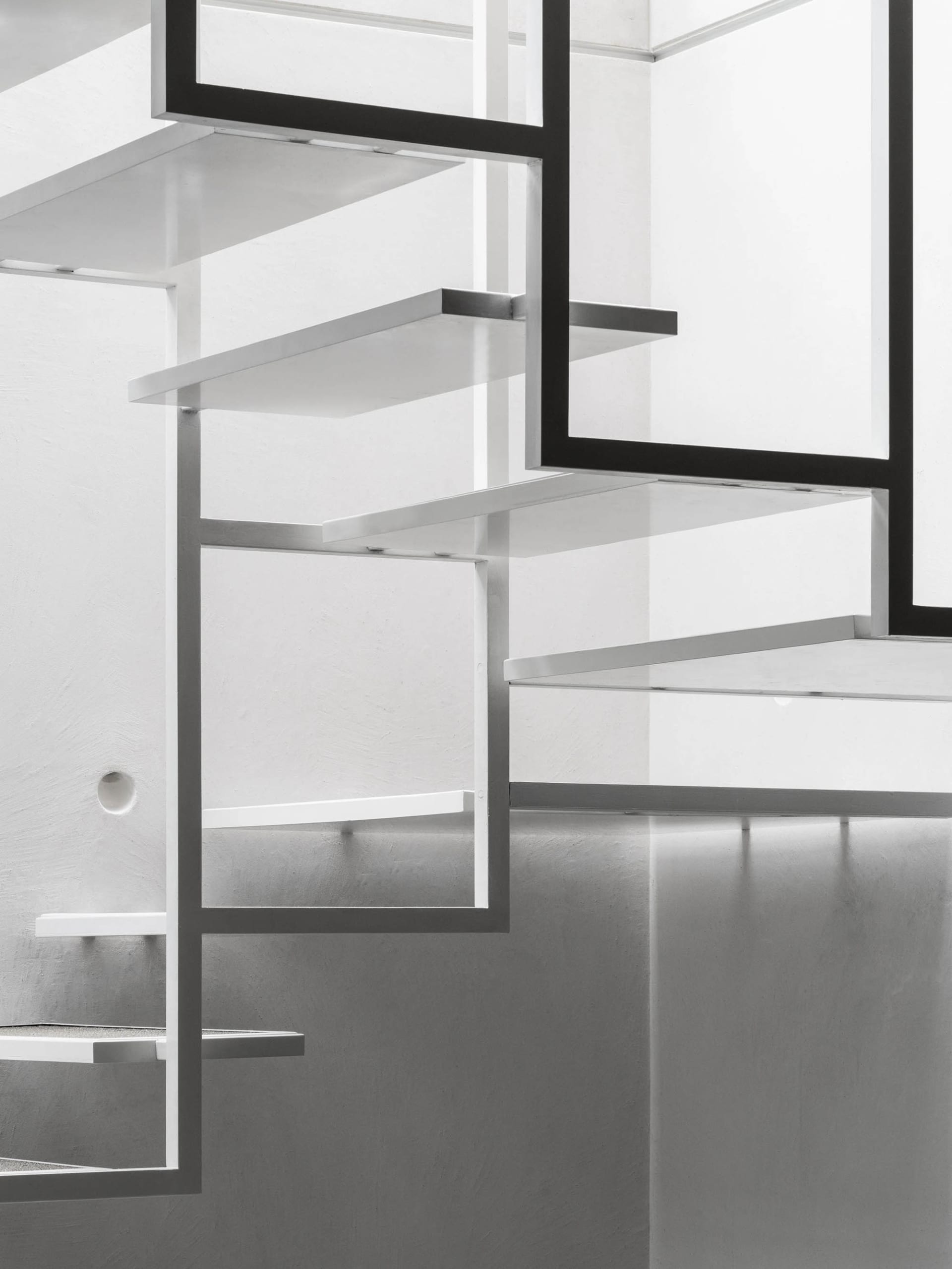 Modern metal staircase with sleek, industrial design elements.