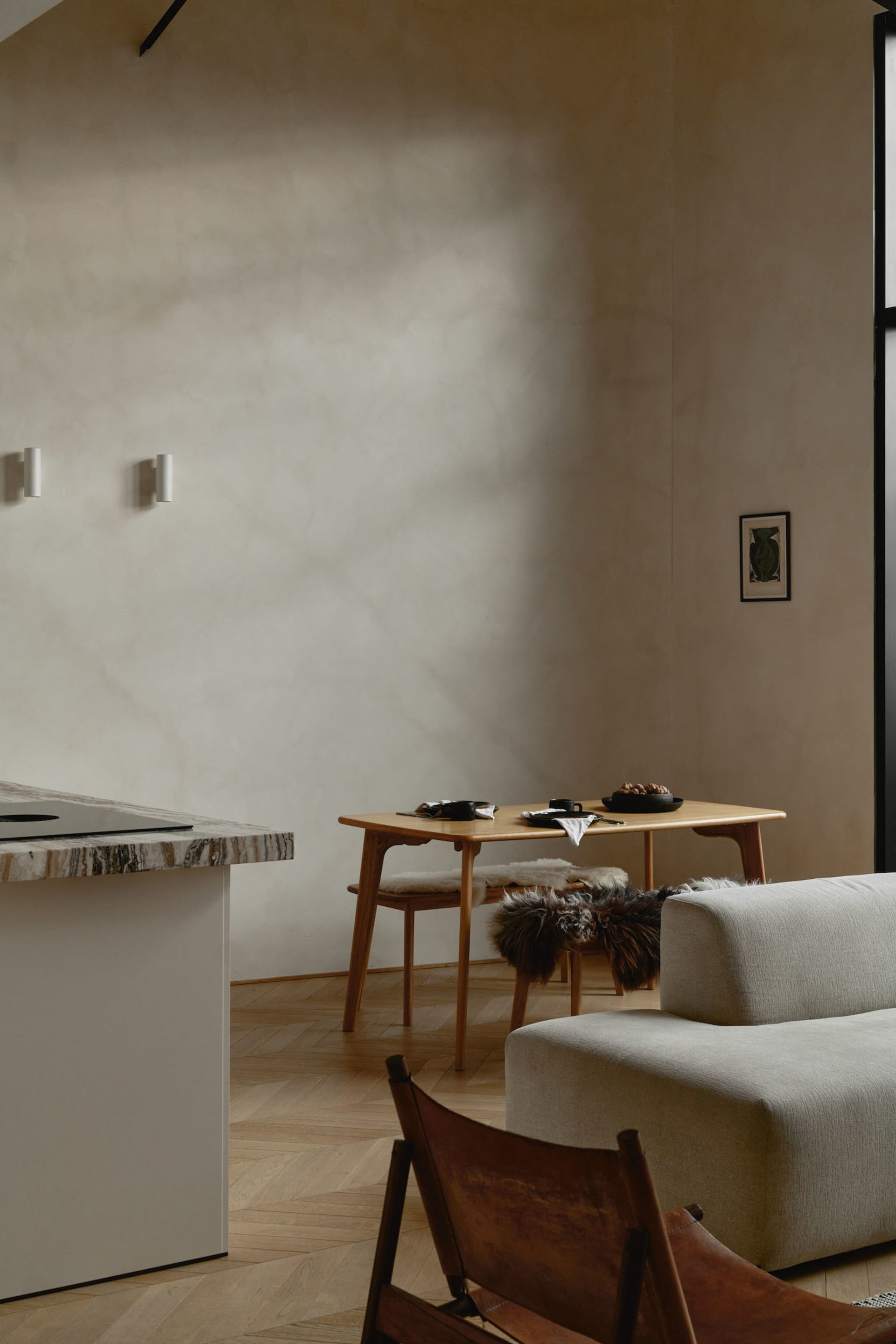 Modern living room featuring wooden furniture with fur accents.
