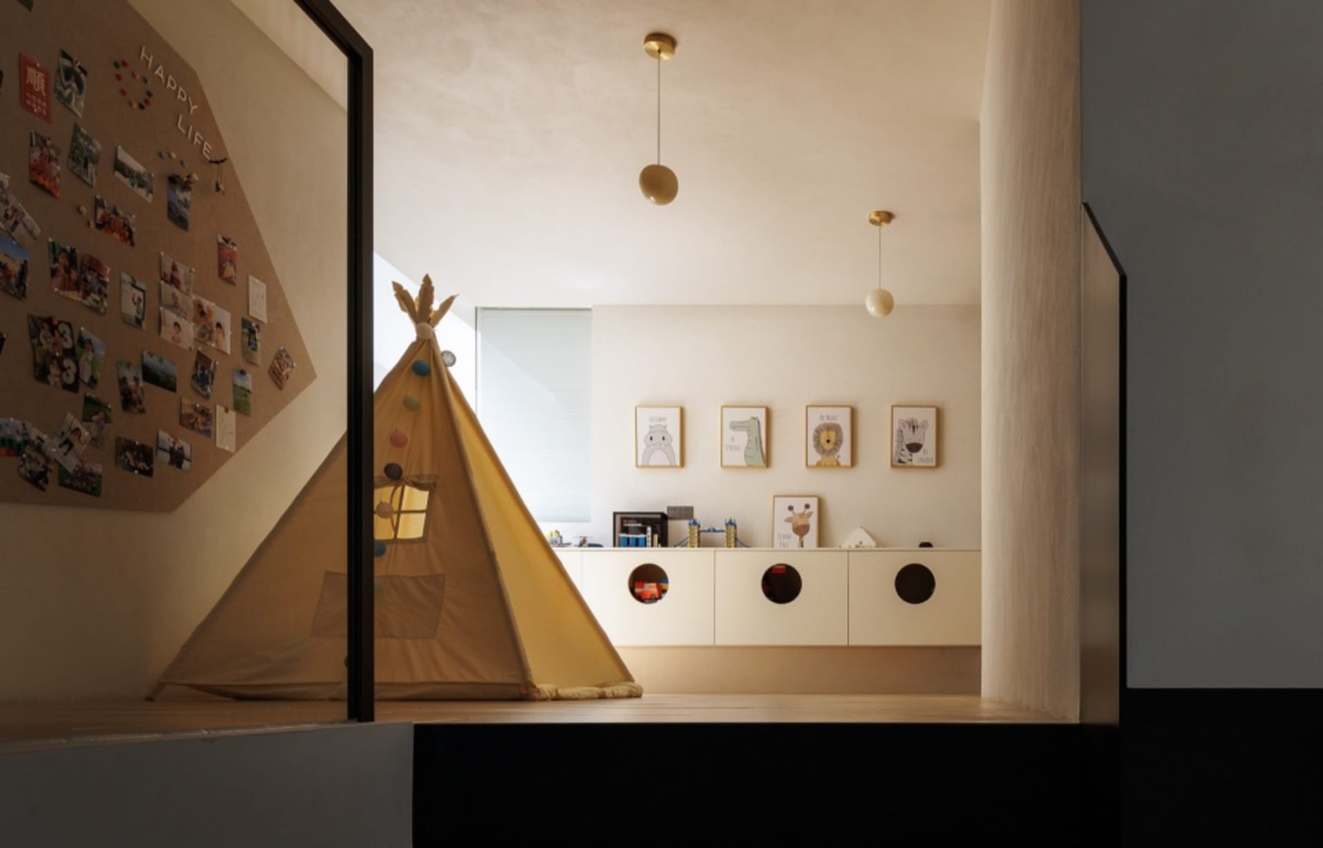A modern playroom with a tent, cabinets, and decorative elements.