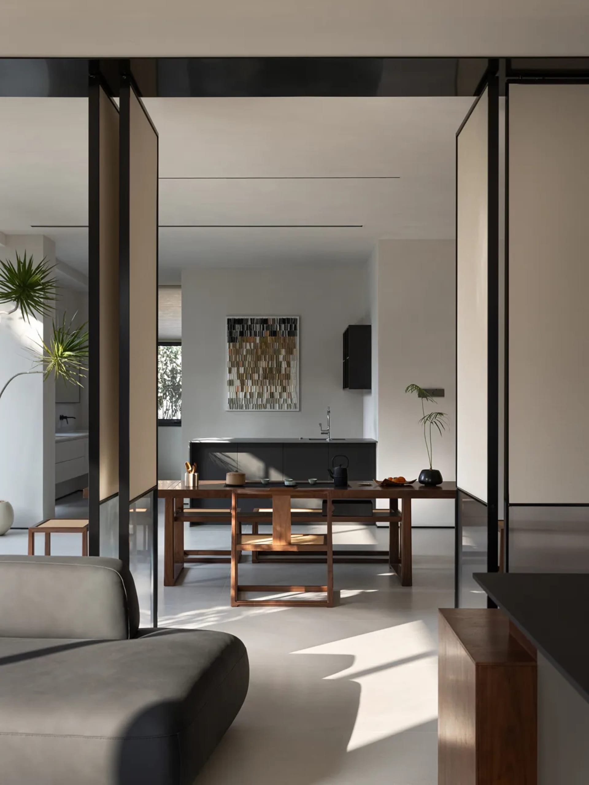Modern living room with wooden furniture and metallic accents.