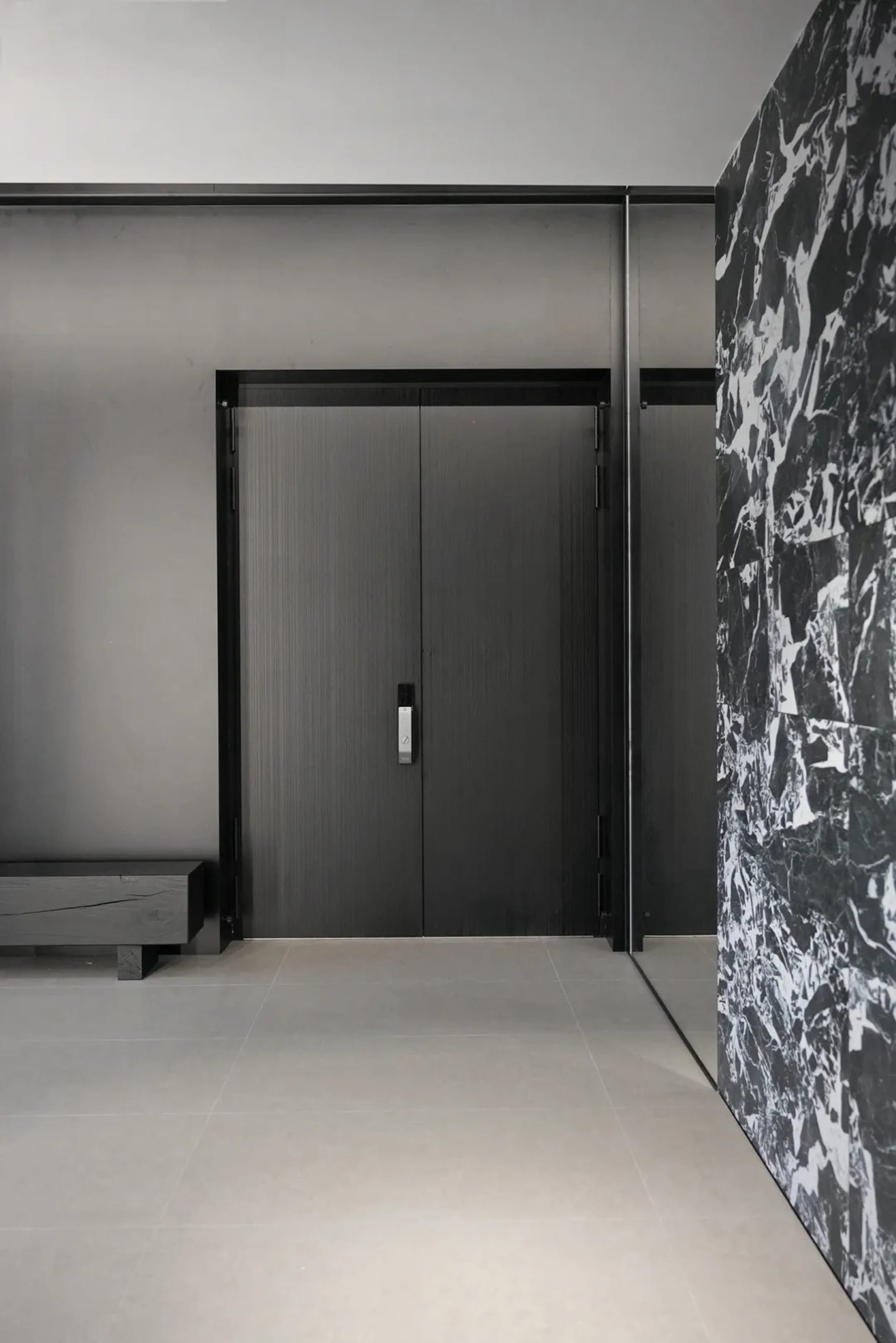 Concrete entrance with simple design in a modern interior setting.