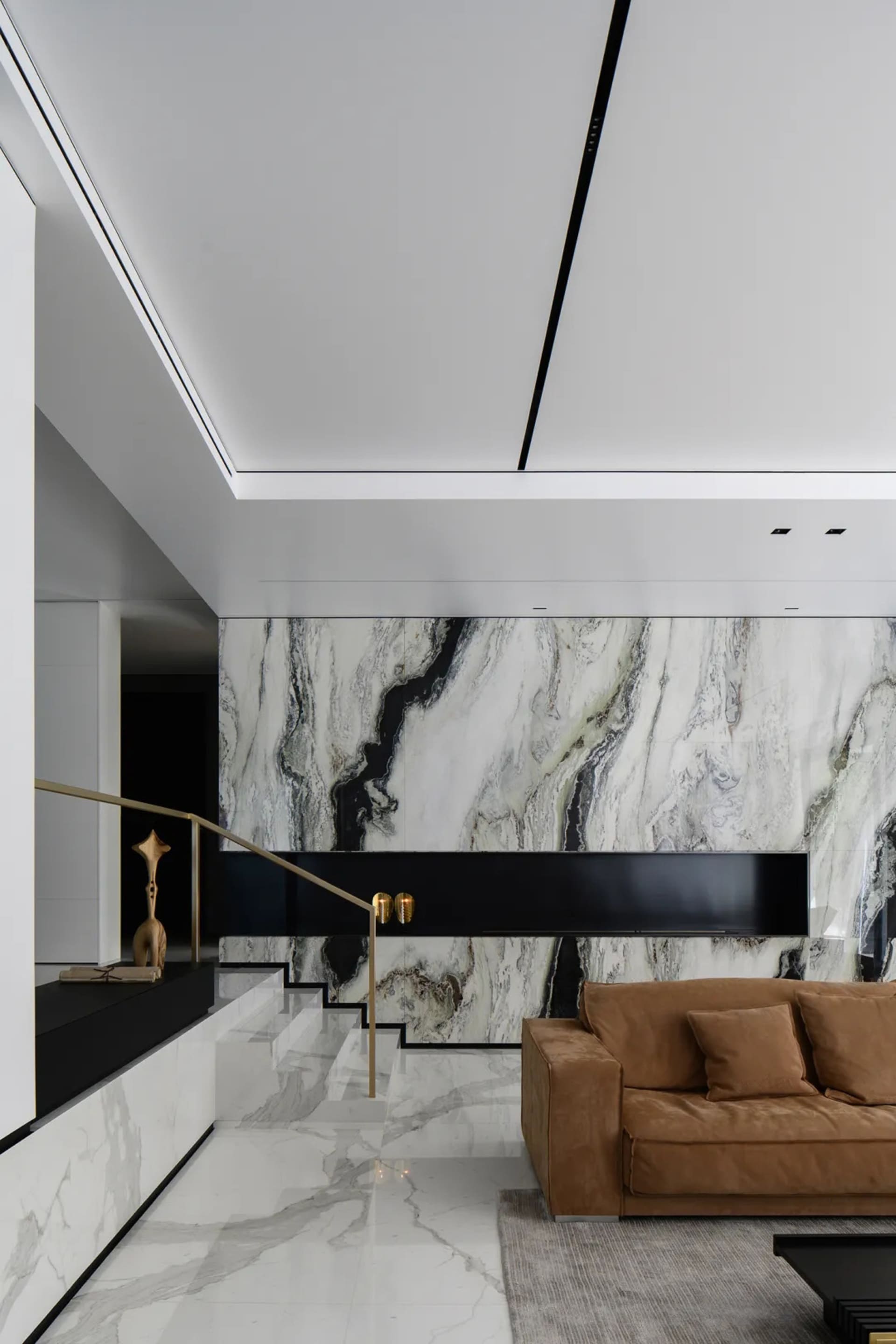 Modern living room with white and black marble walls and floor
