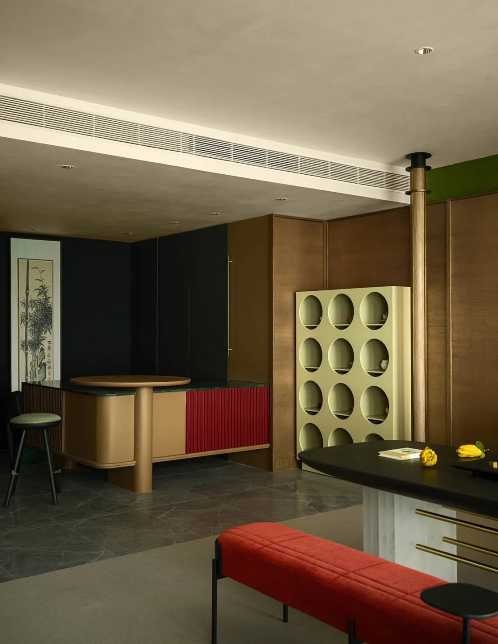 A modern residential bar featuring metal, brass, and copper design elements.