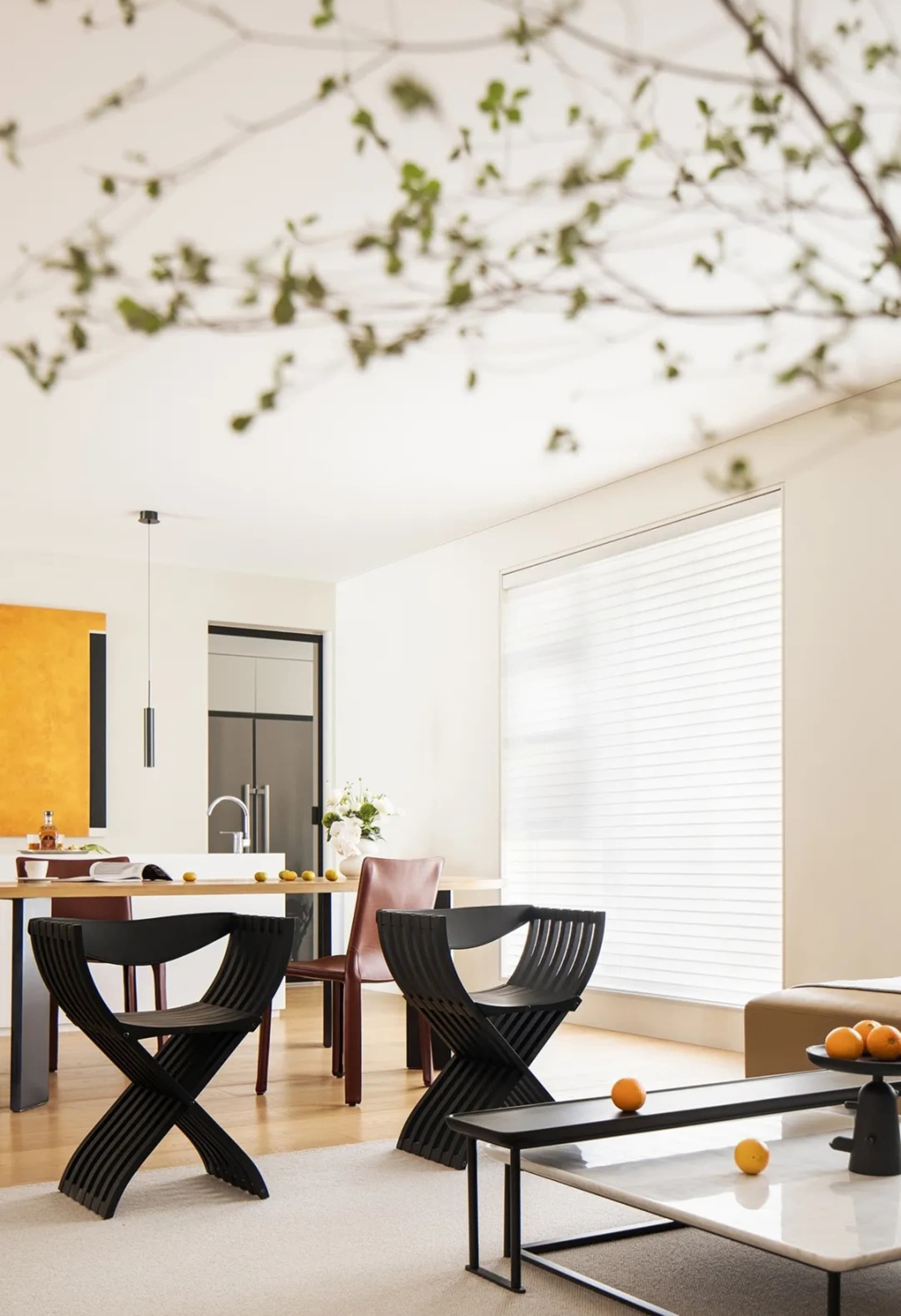 Contemporary living room with minimalist furniture, modern decor, and a sleek coffee table.