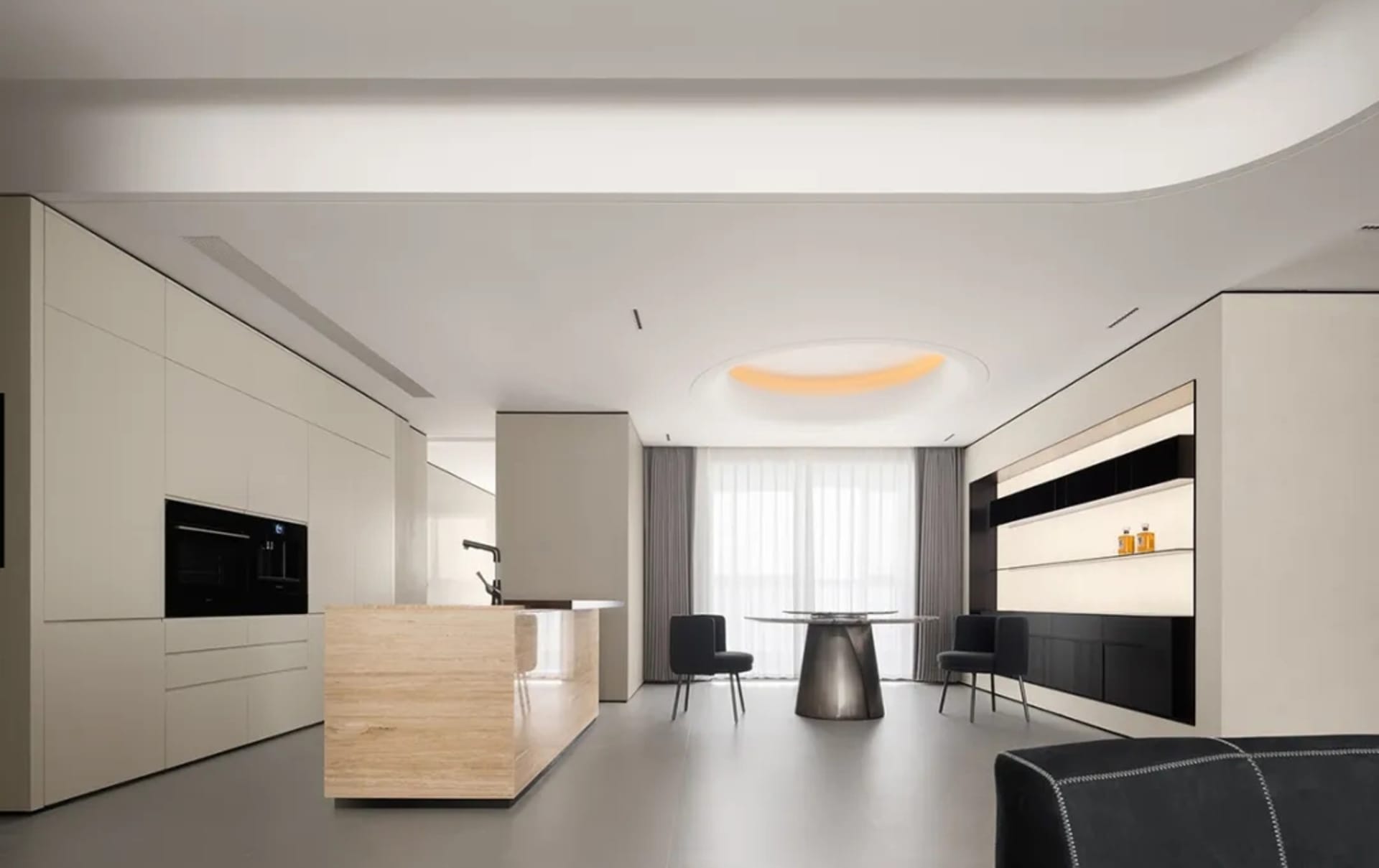 Modern minimalist kitchen with white cabinetry and a wooden island, featuring sleek design and minimalistic aesthetics.