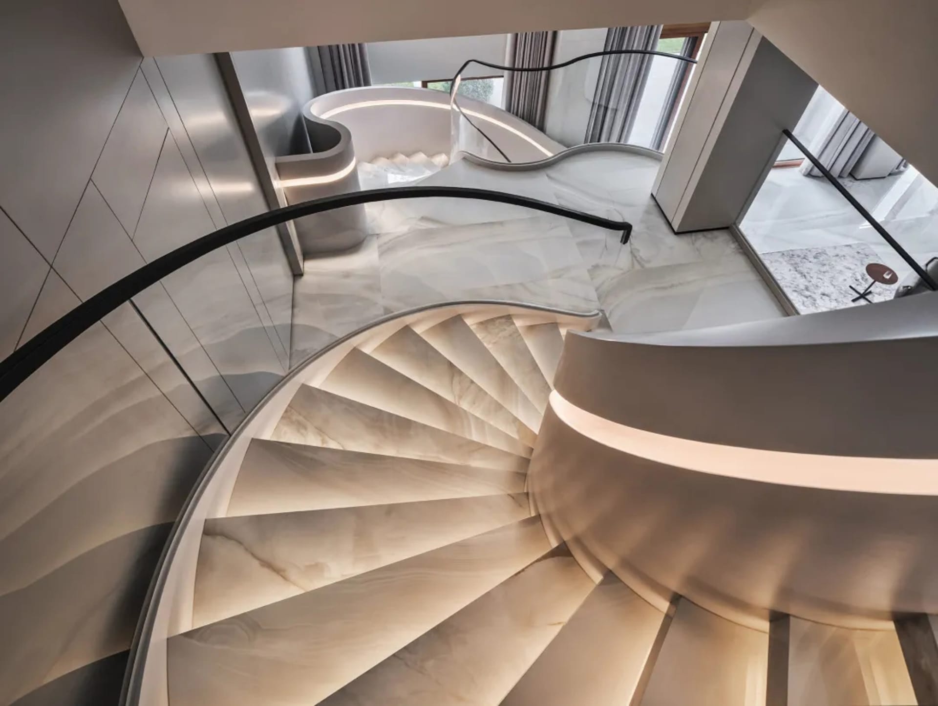 Modern interior staircase with marble steps and lighting