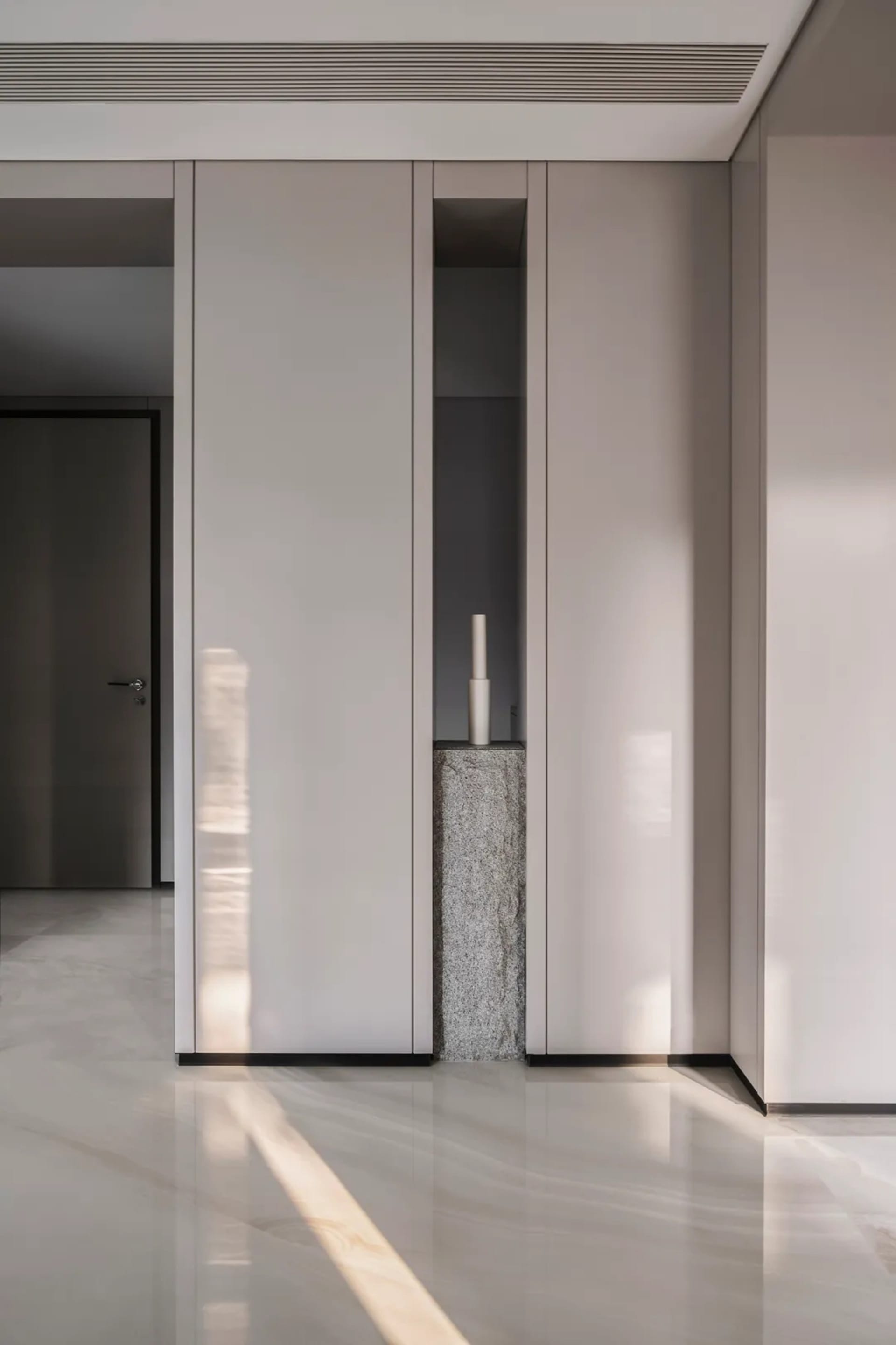 Minimalist interior design featuring concrete columns and sleek, clean lines.