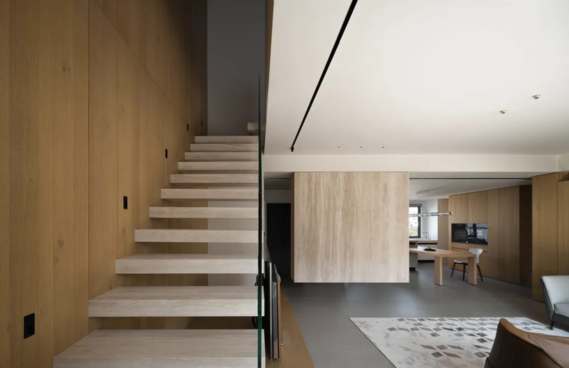 Modern interior space with glass and wood elements.