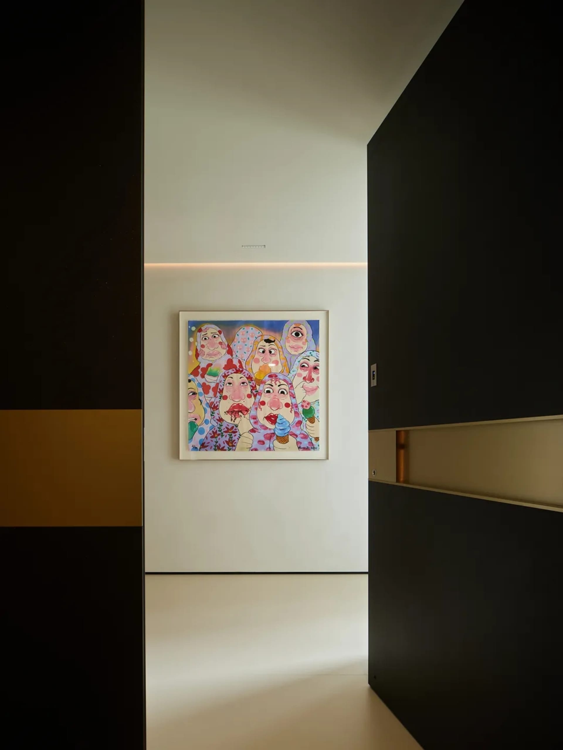 A modern minimalist interior design featuring a contemporary art piece depicting multiple figures.