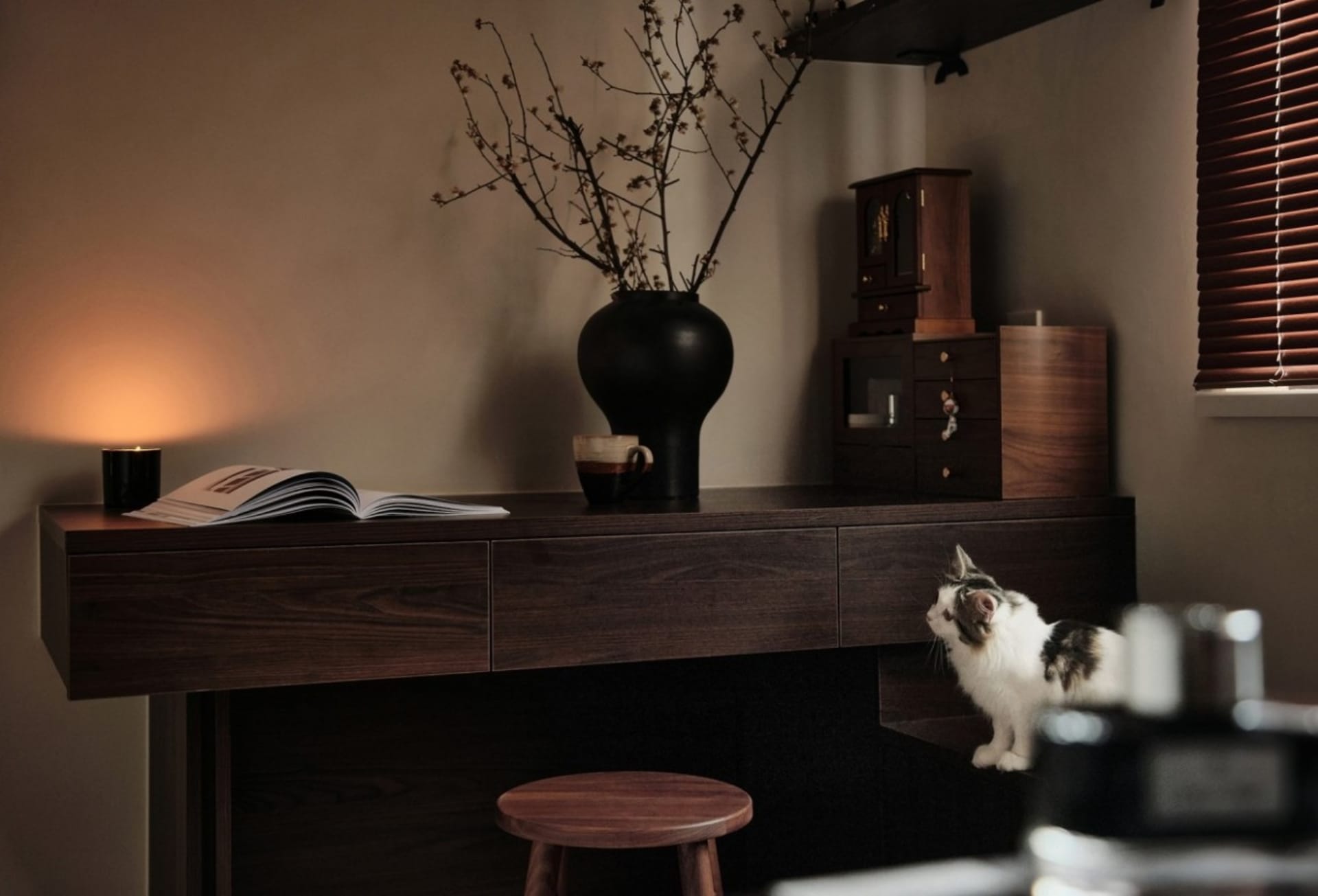 A modern living room with wooden walls and a comfortable seating area.
