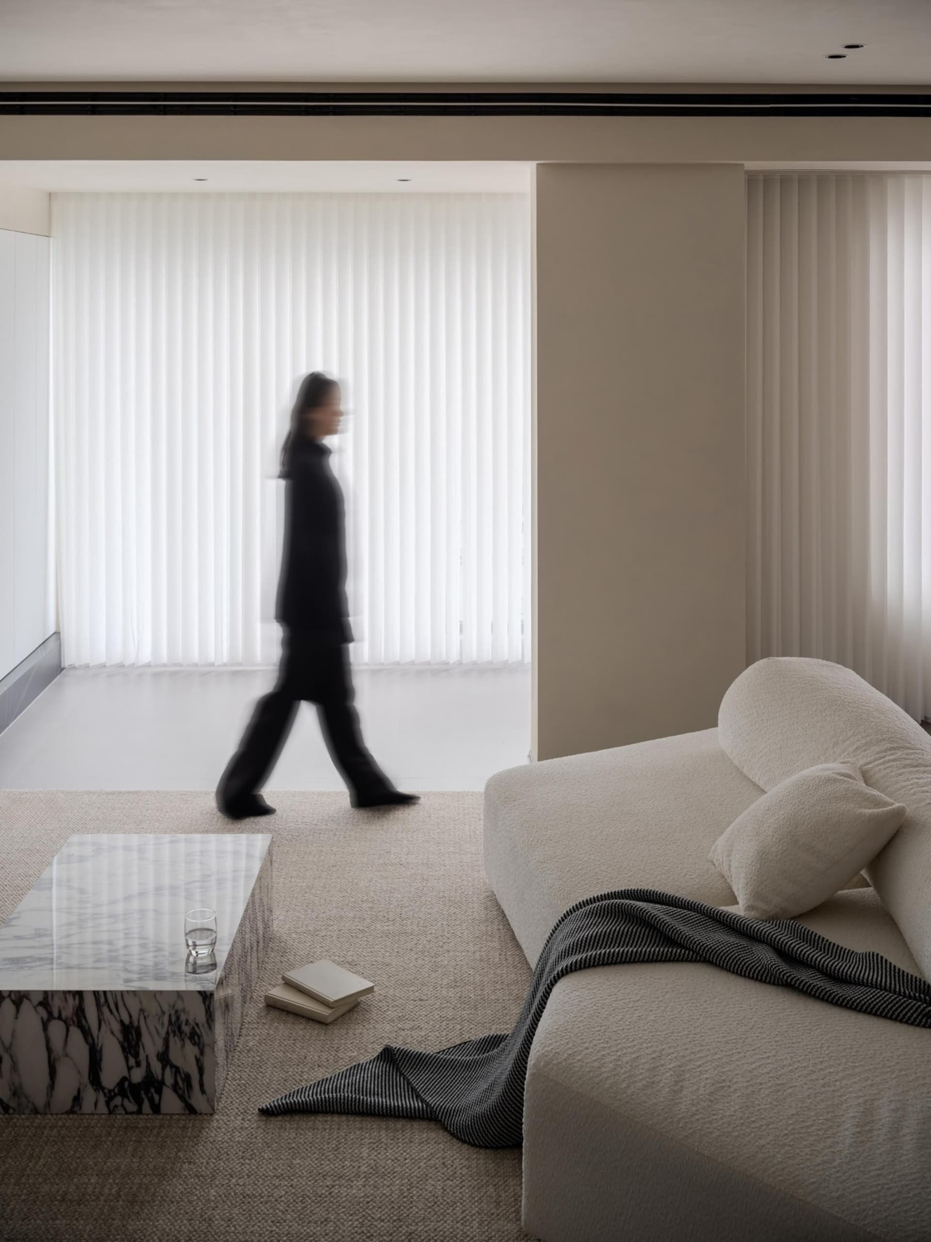 A modern residential sofa upholstered in neutral textiles