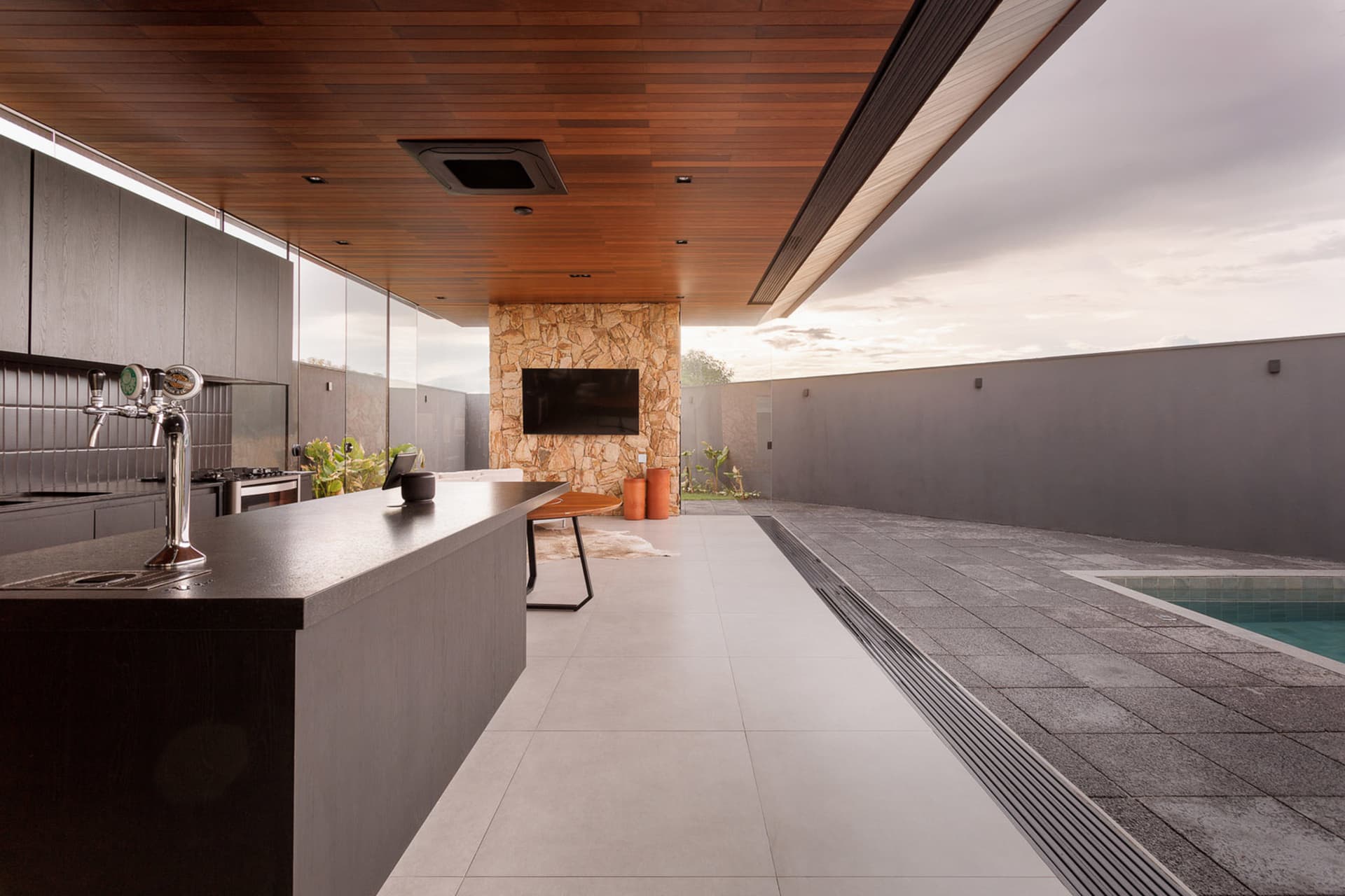 Modern residential space featuring concrete flooring and a contemporary design.