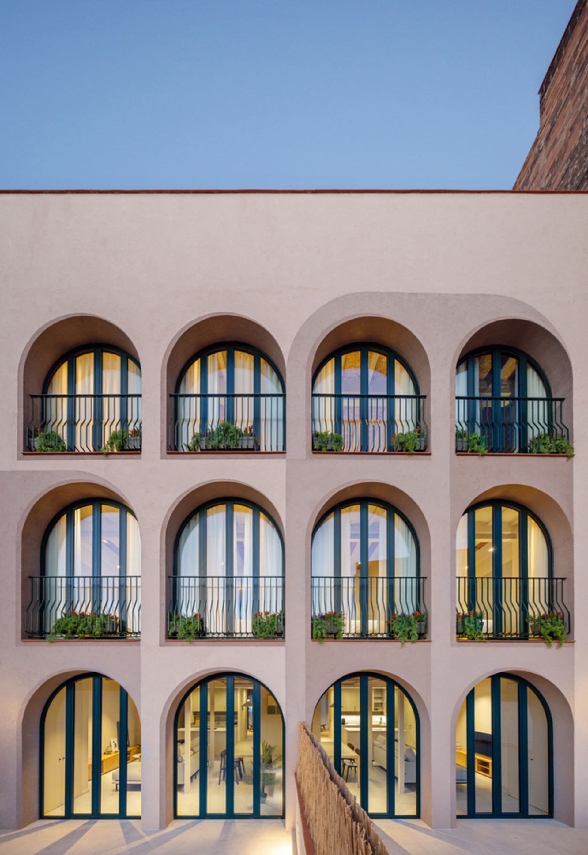 Architectural view of a modern residential complex featuring geometric concrete architecture.