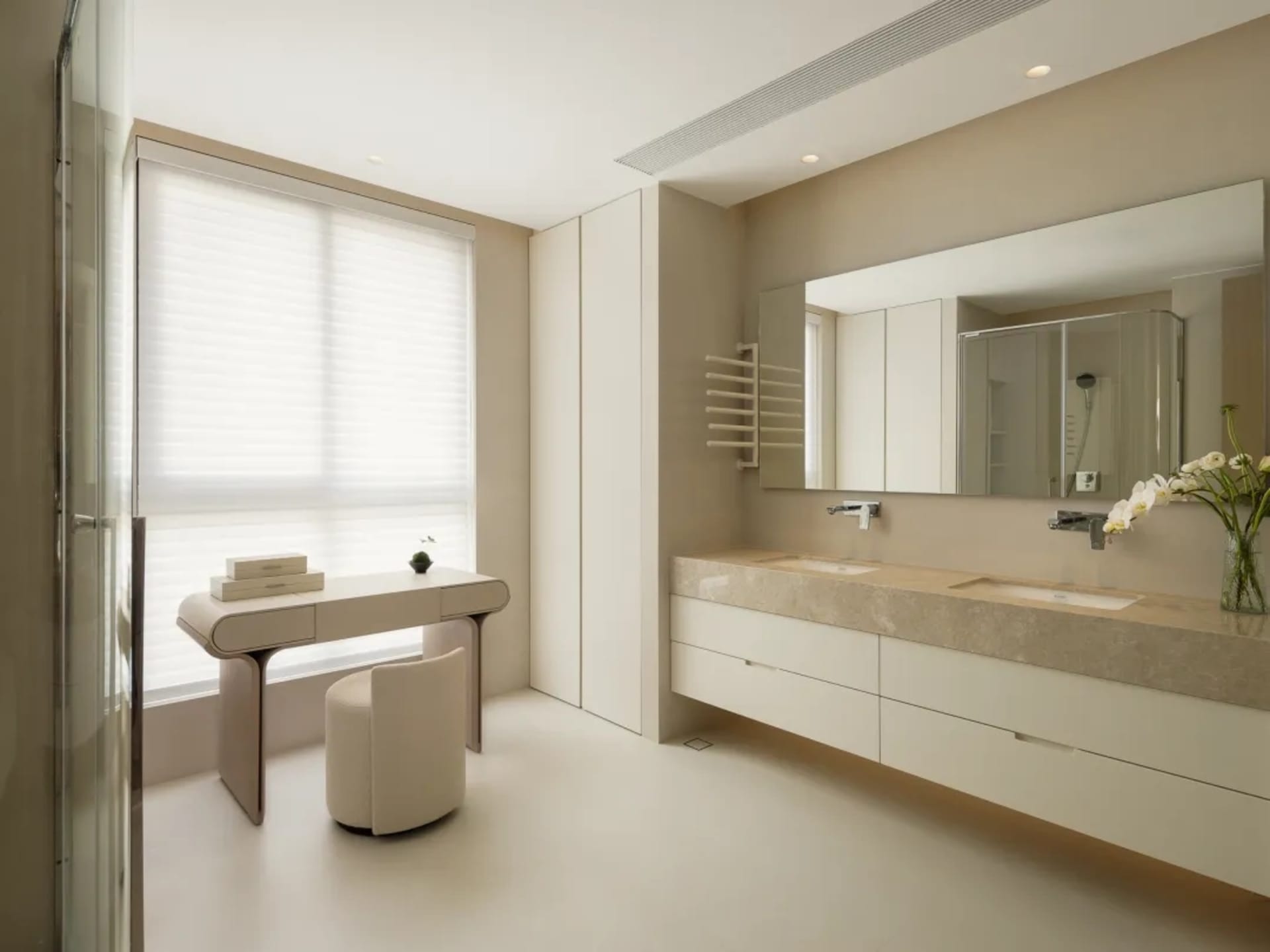 Modern bedroom featuring minimalist design with concrete walls and white furniture.