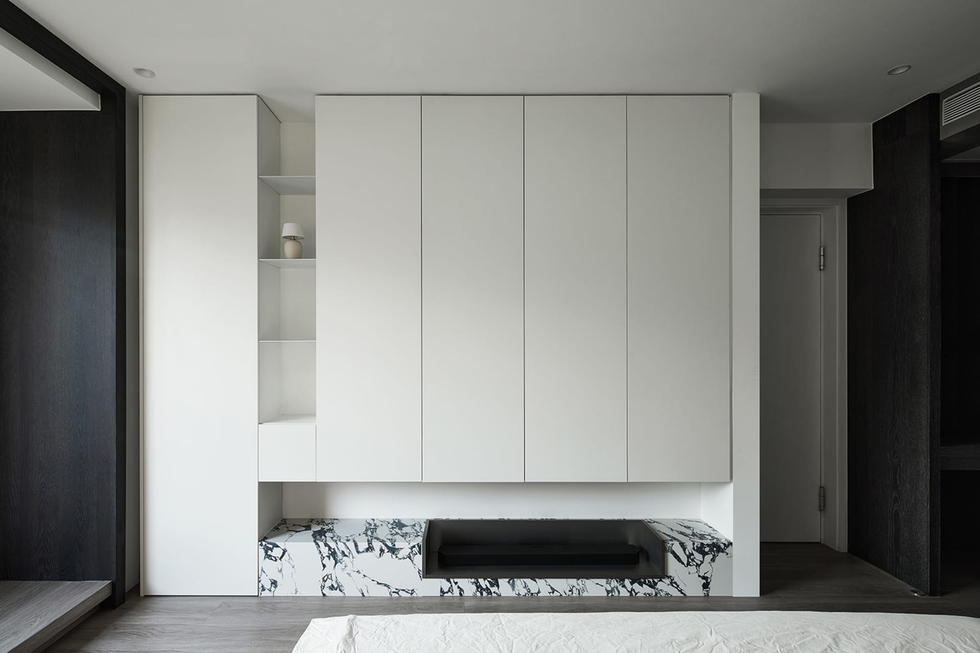 Modern bedroom featuring a marble storage unit