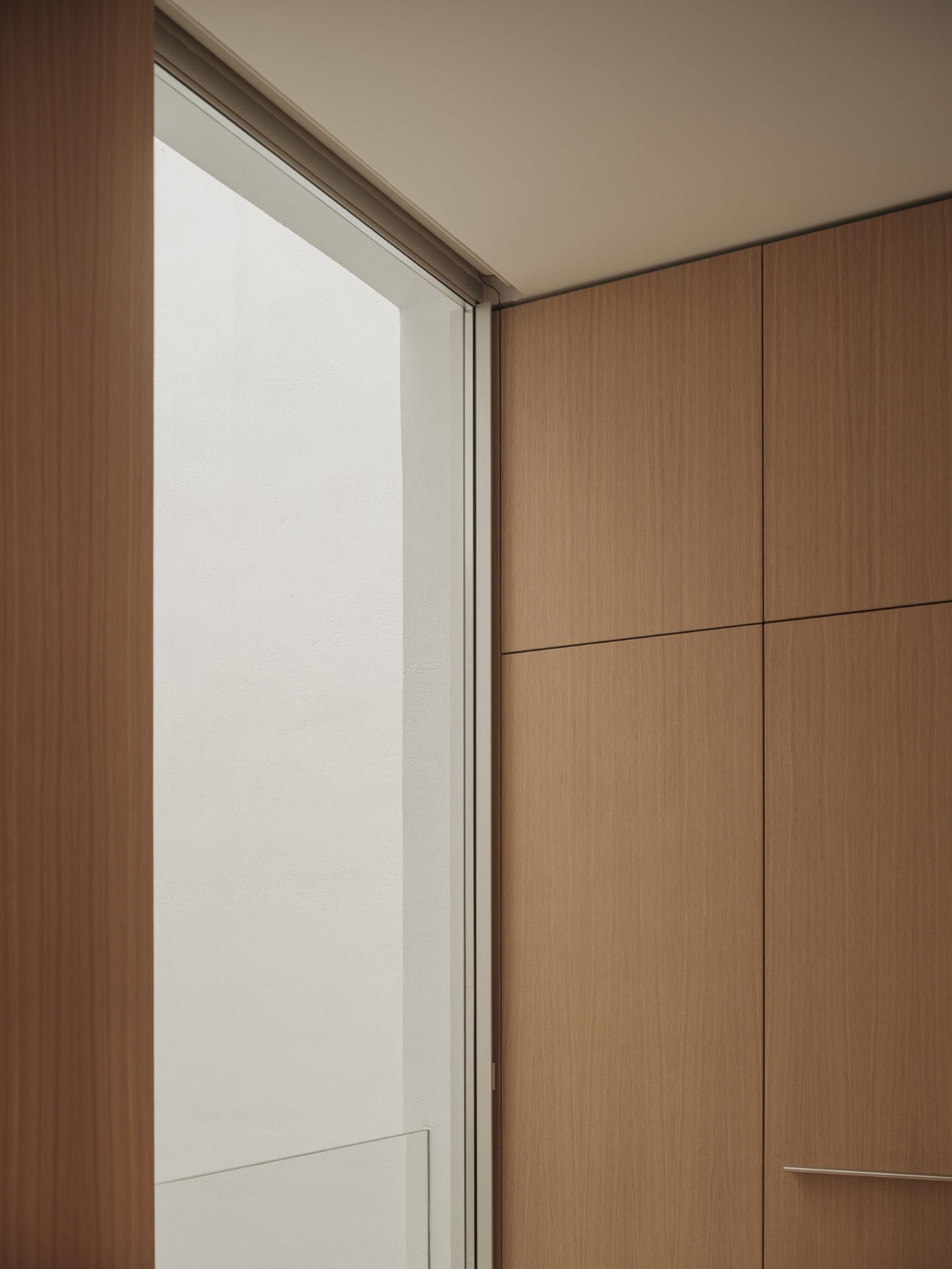 A sophisticated interior design featuring modern wooden panels, suitable for high-end residential or commercial spaces.