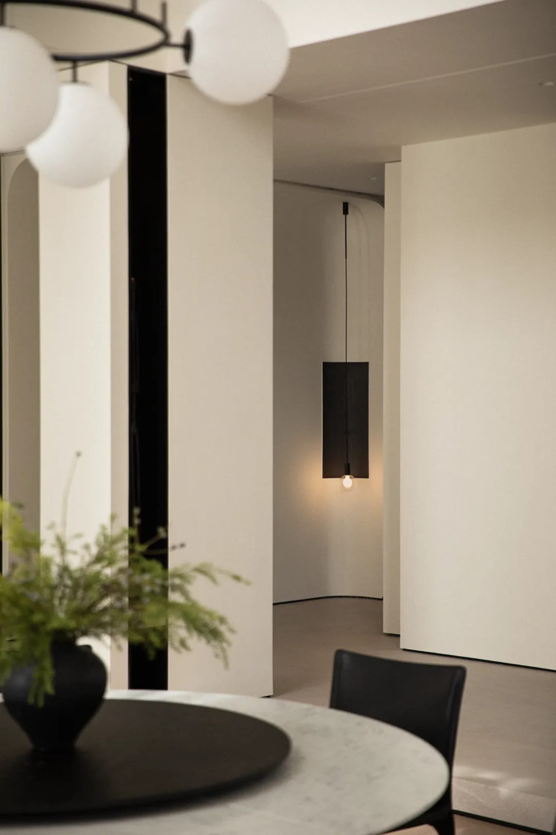 A minimalist space with modern lighting fixtures.