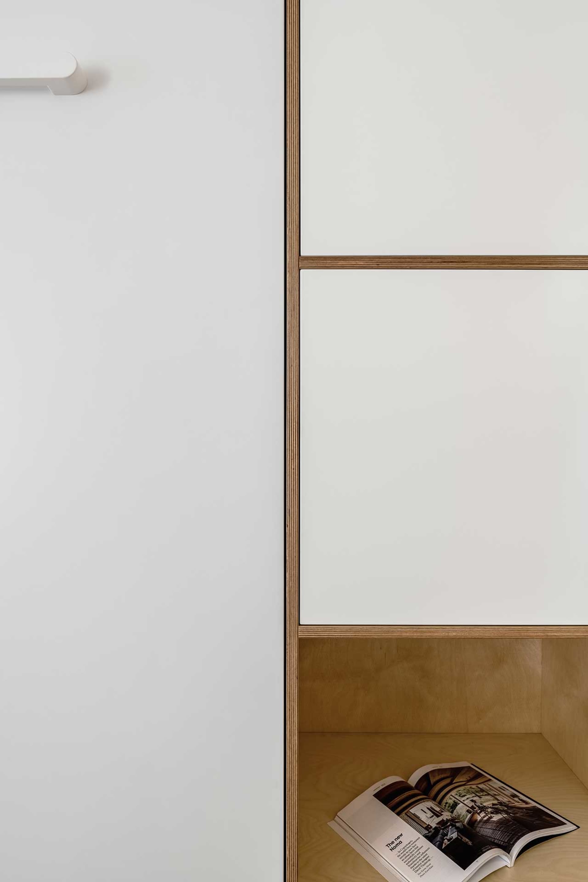 A minimalist bookshelf made of walnut wood.