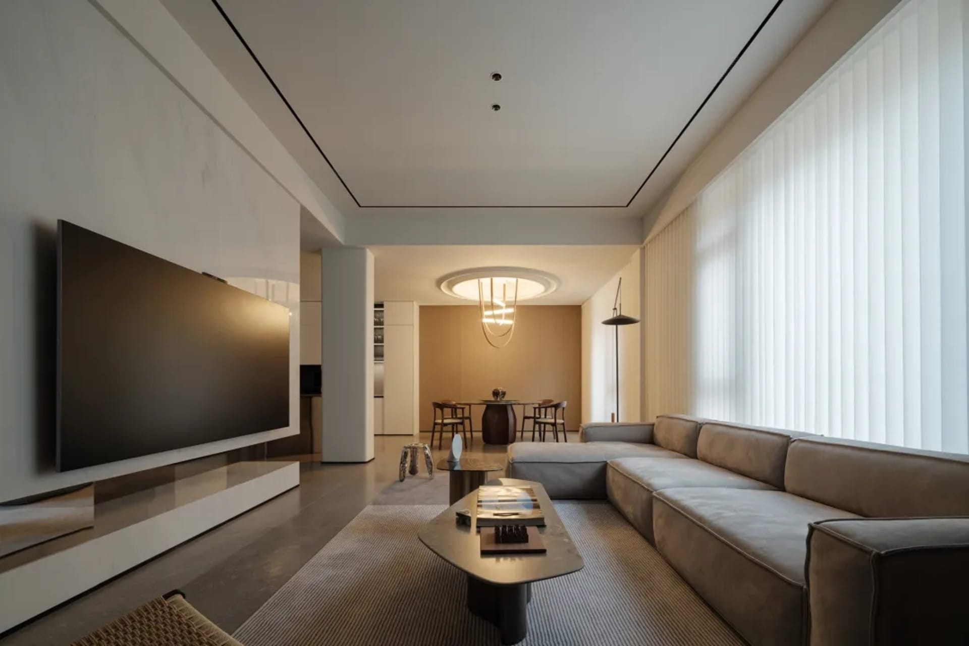 Modern living room with concrete floor, wooden furniture, and minimalist design.