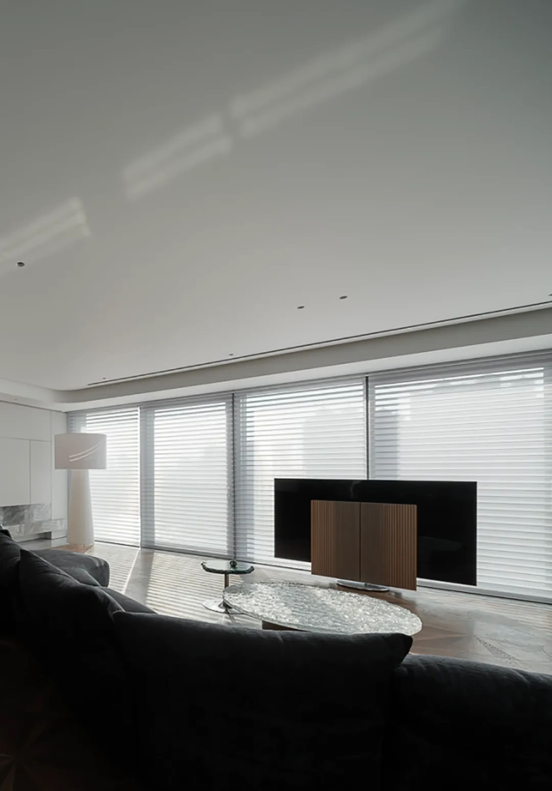 Contemporary living space featuring metallic sofa and coffee table.