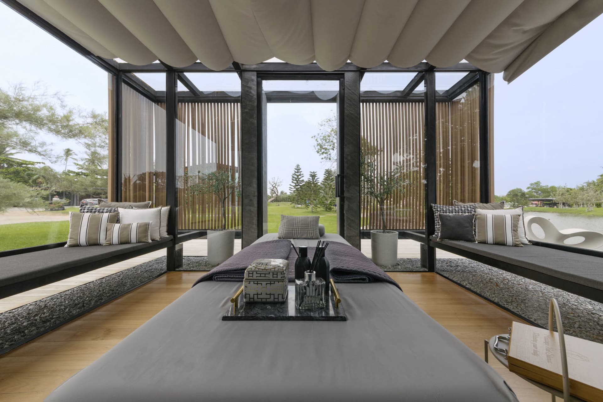 Spa relaxation room with concrete, glass, and wood materials