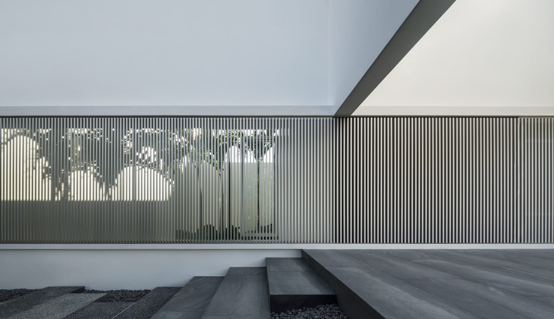 A modern exterior design featuring concrete materials.