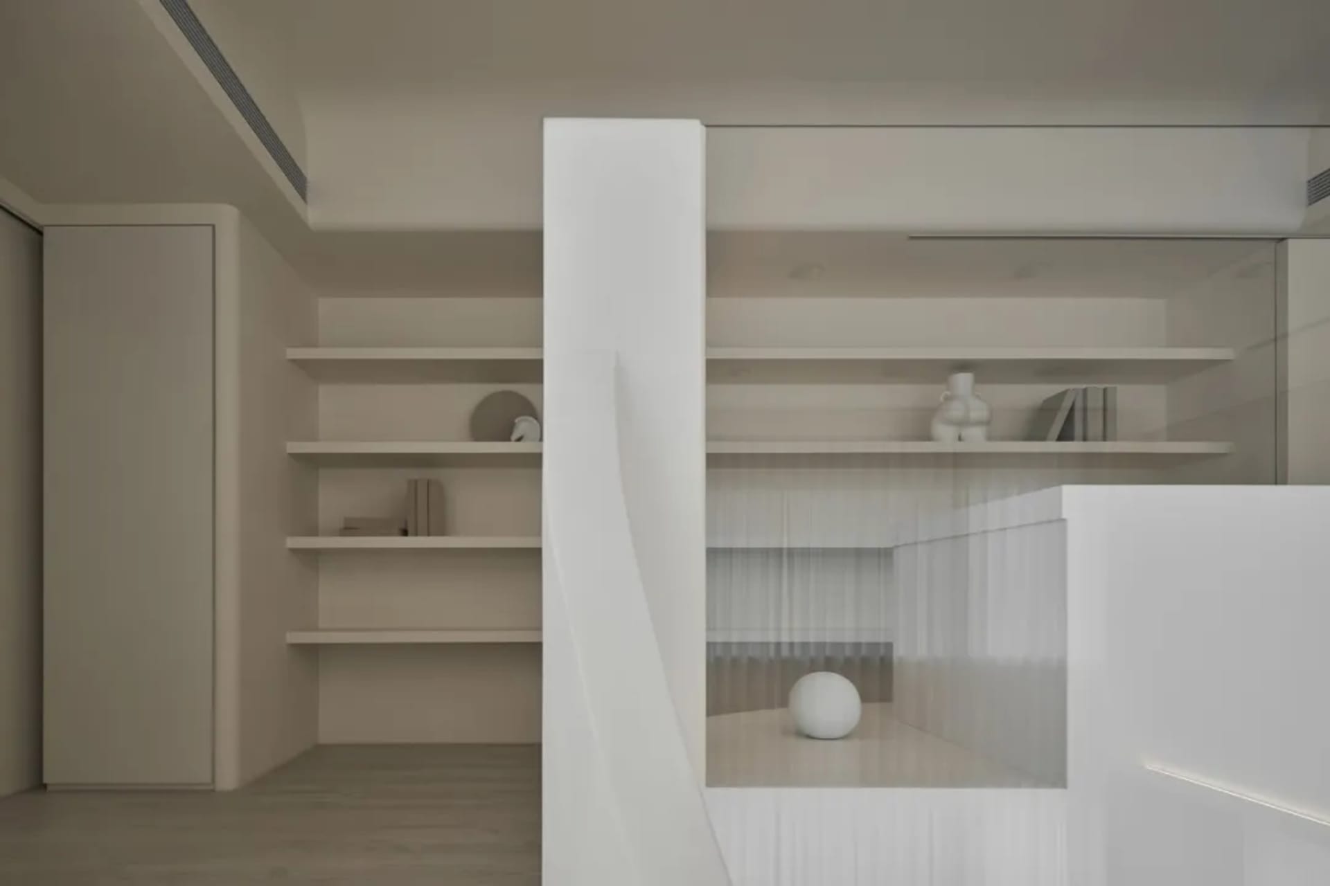 A minimalist interior space featuring modern wooden shelving with books and decorative items.