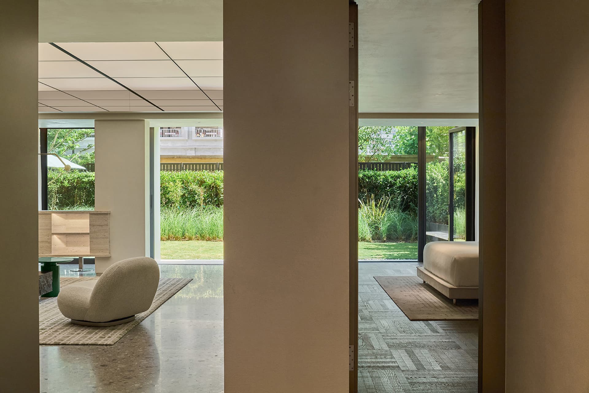 Interior design featuring a minimalist living room with neutral-toned materials