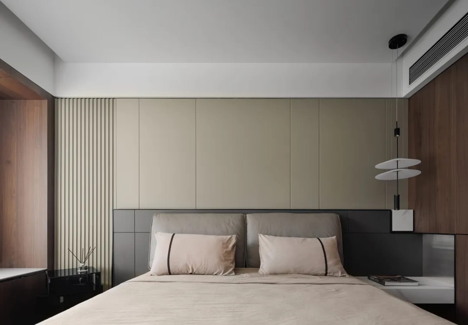 Modern bedroom featuring wooden elements and a minimalist design.