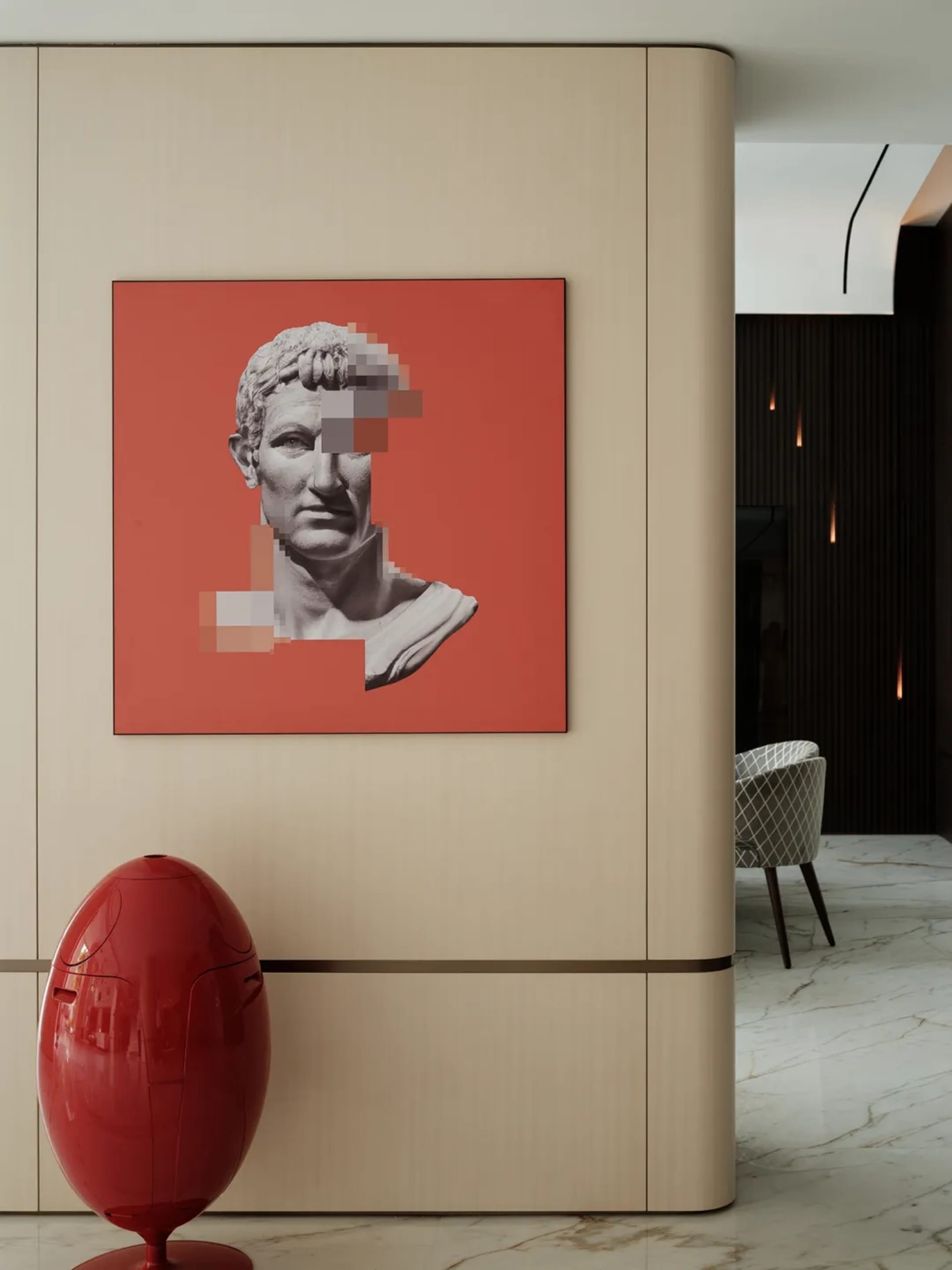 Modern art piece featuring a concrete wall with abstract design on a red background.
