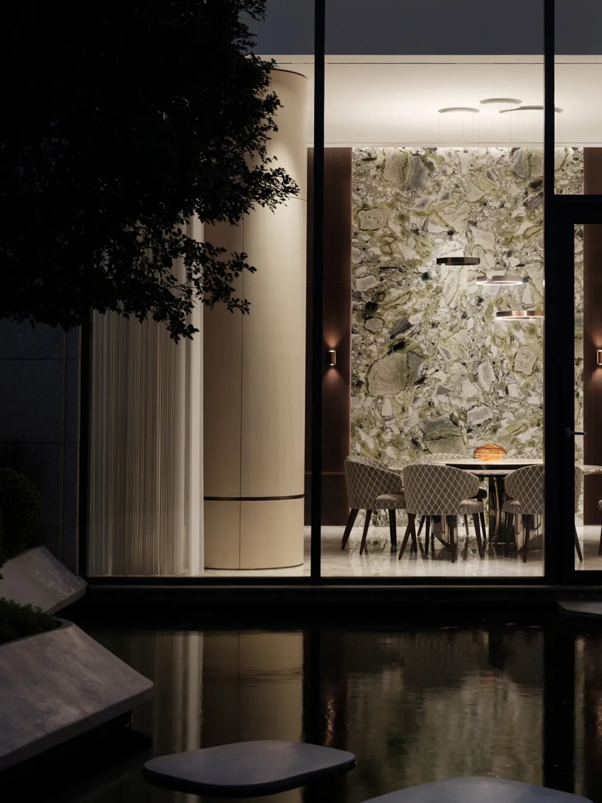 A modern restaurant interior featuring a marble wall and table