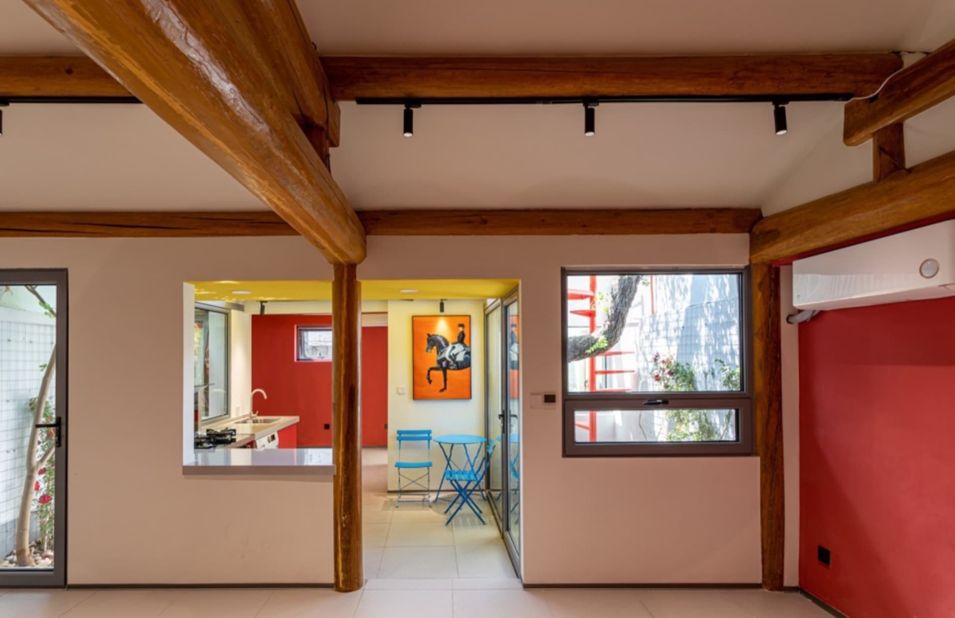 A contemporary residential space featuring a mix of metal and wooden elements.