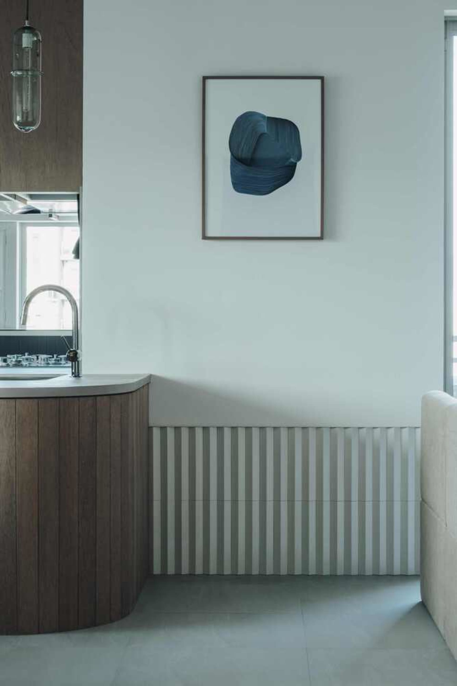 A modern interior design featuring metallic wood elements.