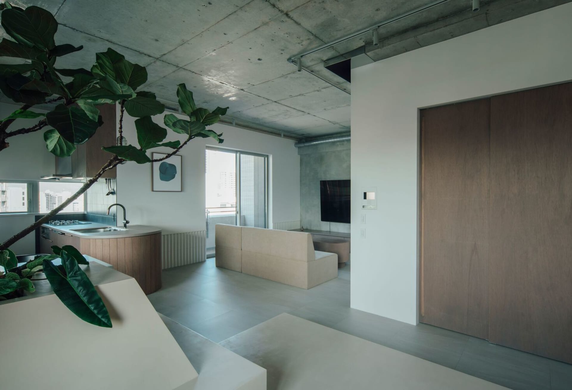 A minimalist residential space featuring concrete elements.