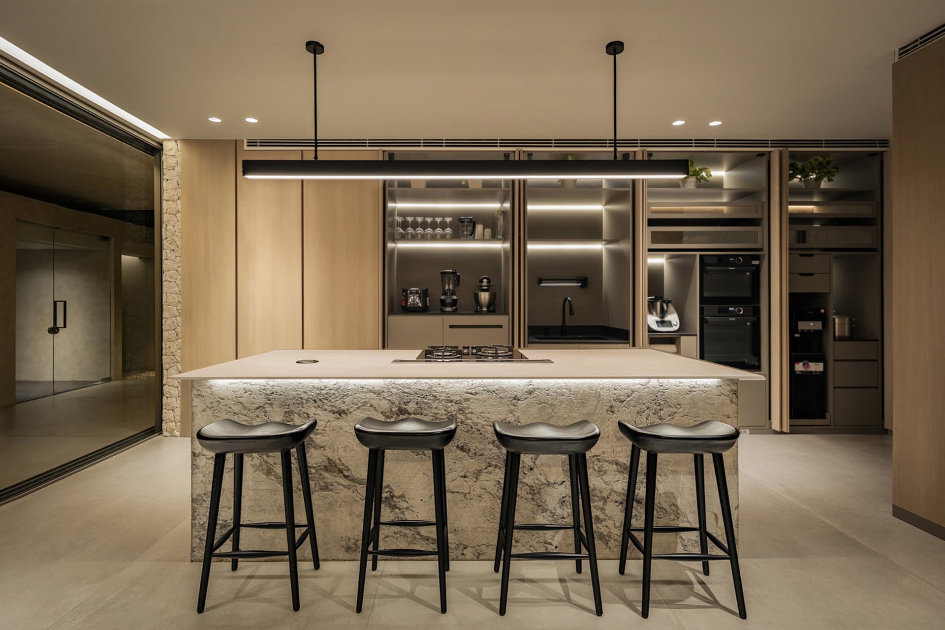 Modern studio apartment featuring concrete walls and floors.