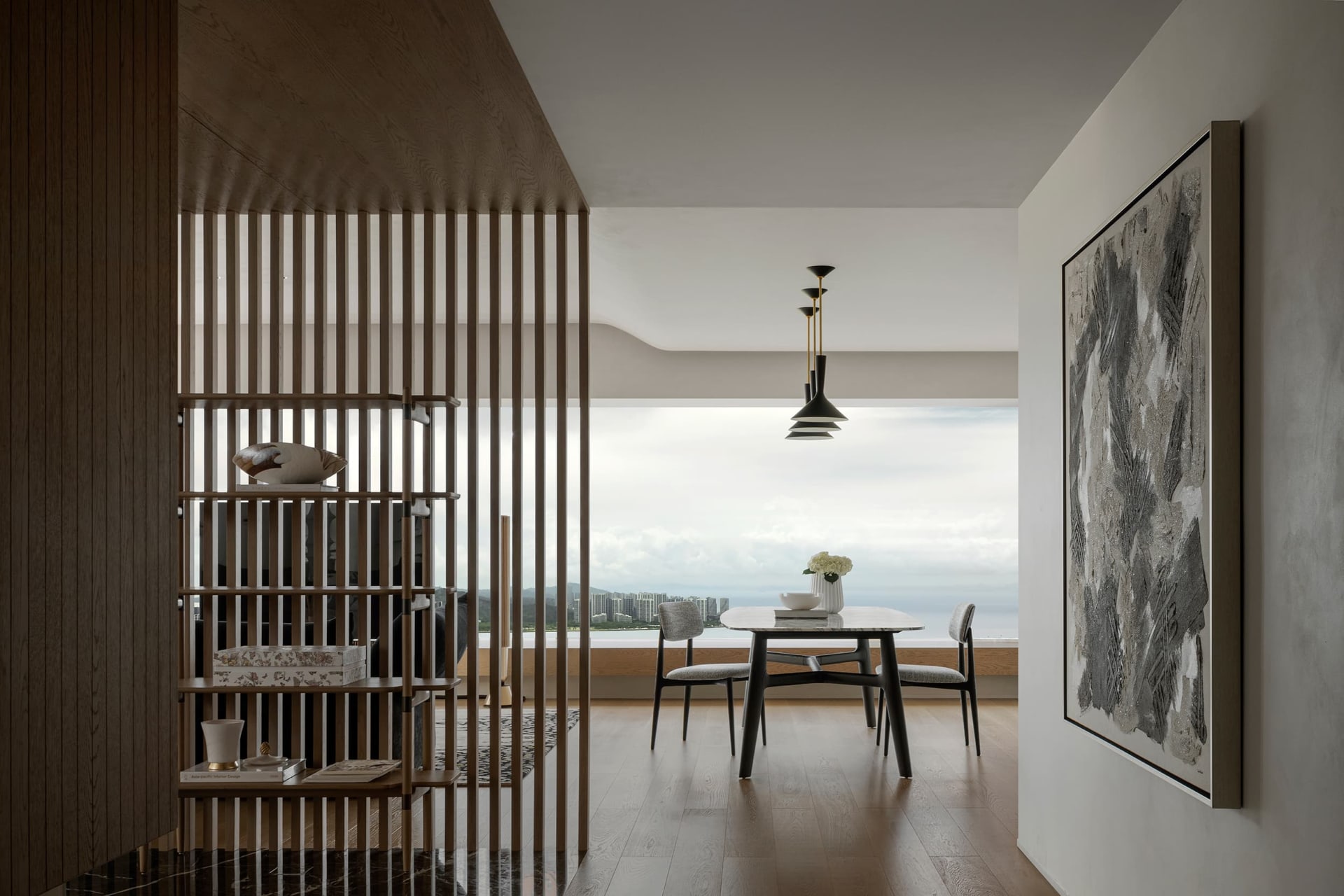 Modern interior design featuring a marble coffee table and gray sofas.