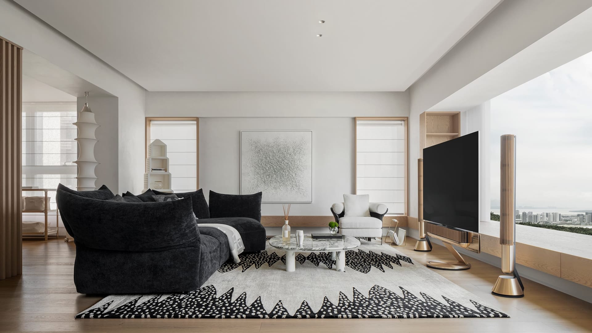 Modern living room featuring wooden flooring, glass walls, and leather furniture.