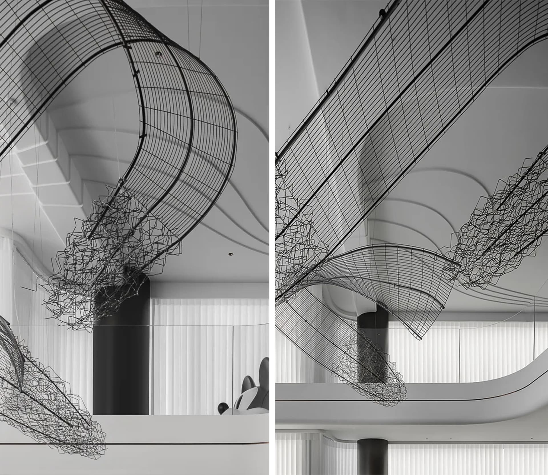 Modern interior design featuring metal netting hanging from the ceiling.