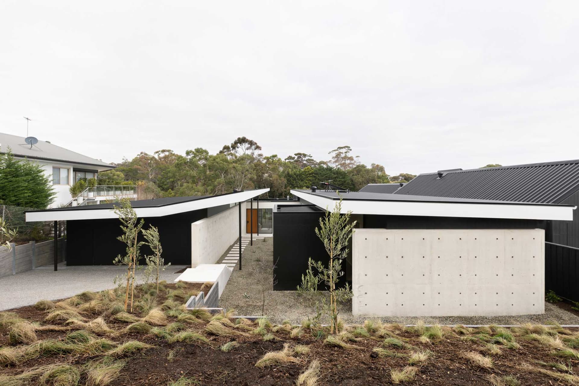 A modern house with concrete walls and a minimalist design.