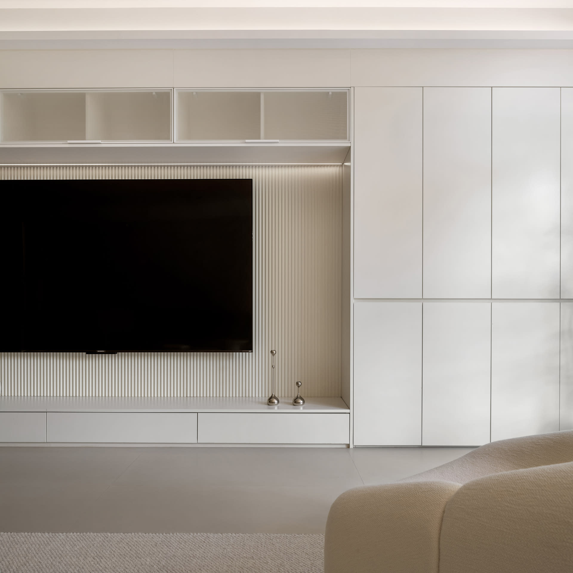 Modern minimalist living room with white walls and a white sofa