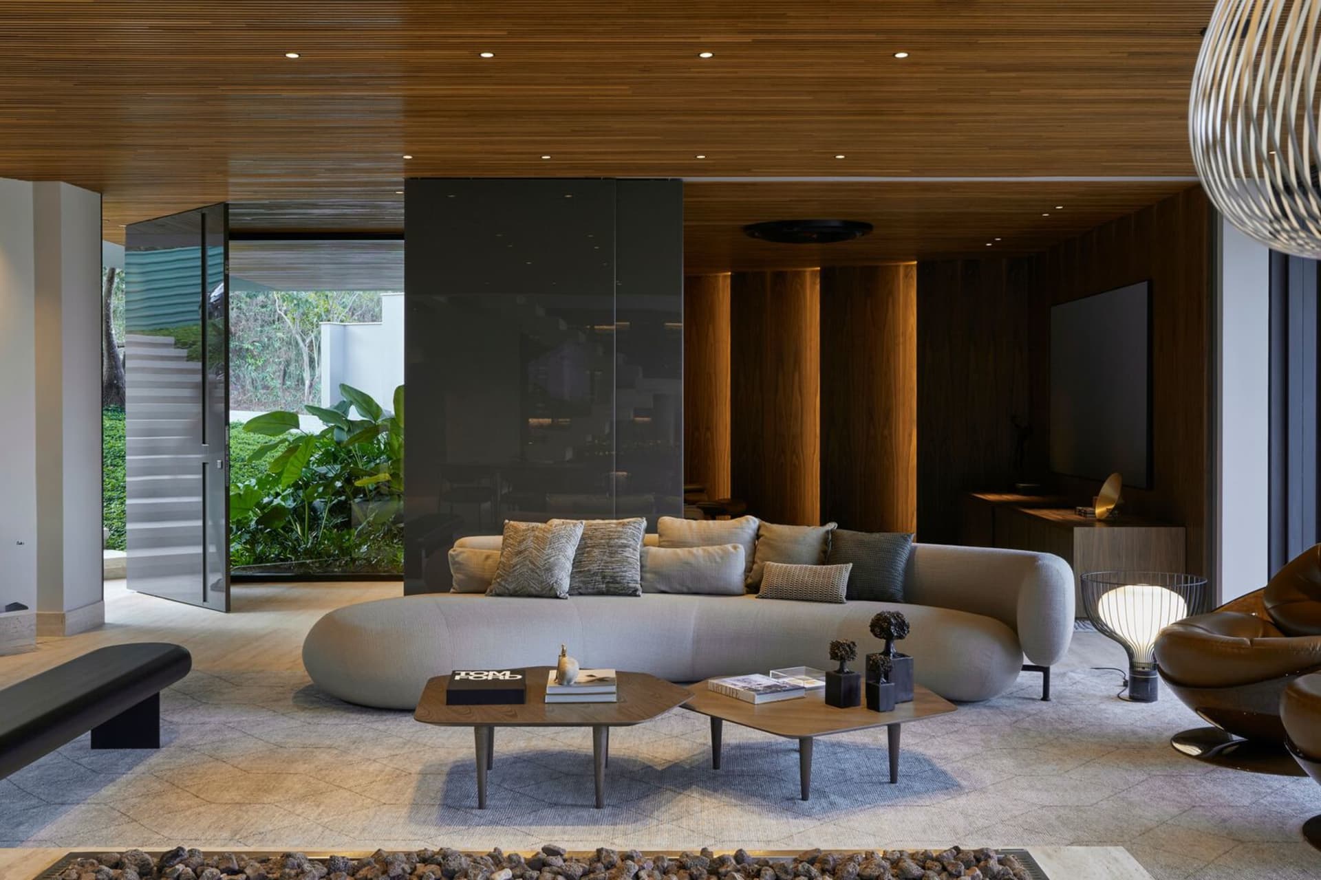 A modern living room with neutral-toned furnishings and a minimalist design.