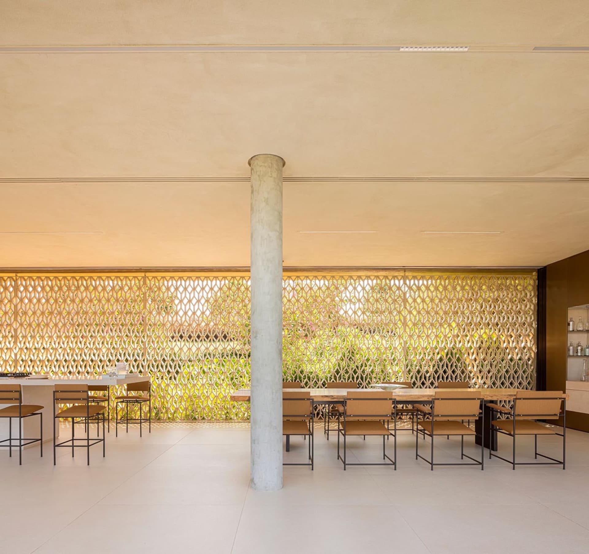Modern kitchen interior with cement walls, minimalist design, and open layout.