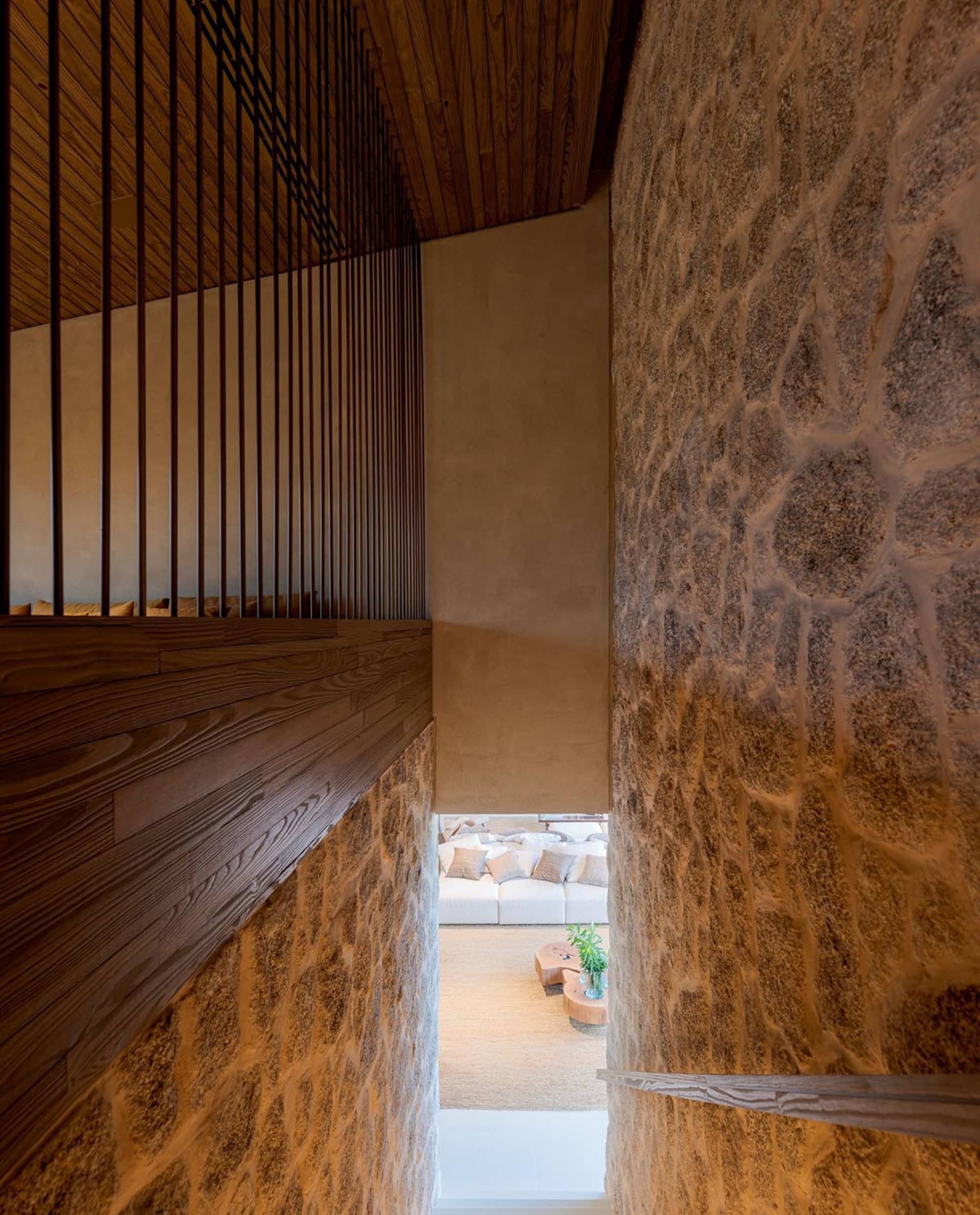 Modern interior space featuring textured concrete walls and minimalist design.
